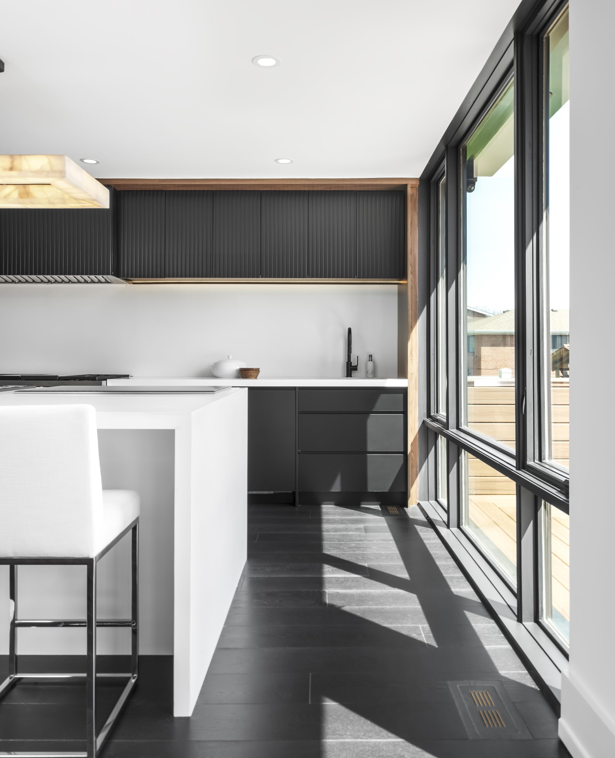 Minimal black-and-white kitchen cabinetry