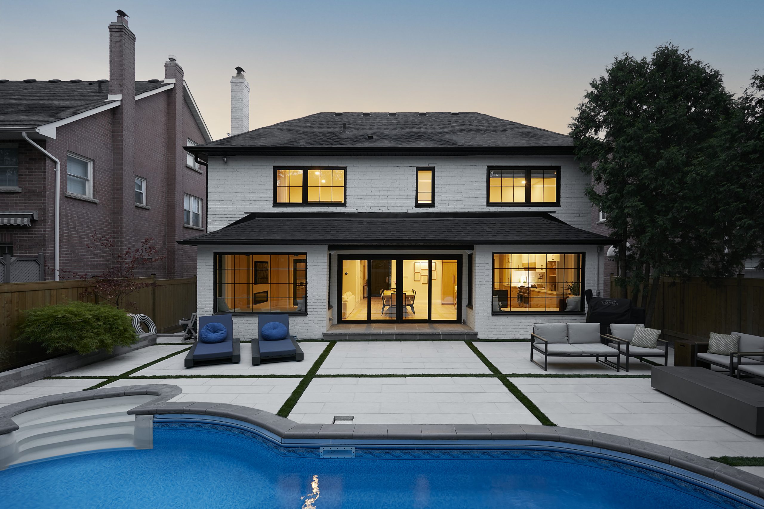 Rear elevation and pool at dusk