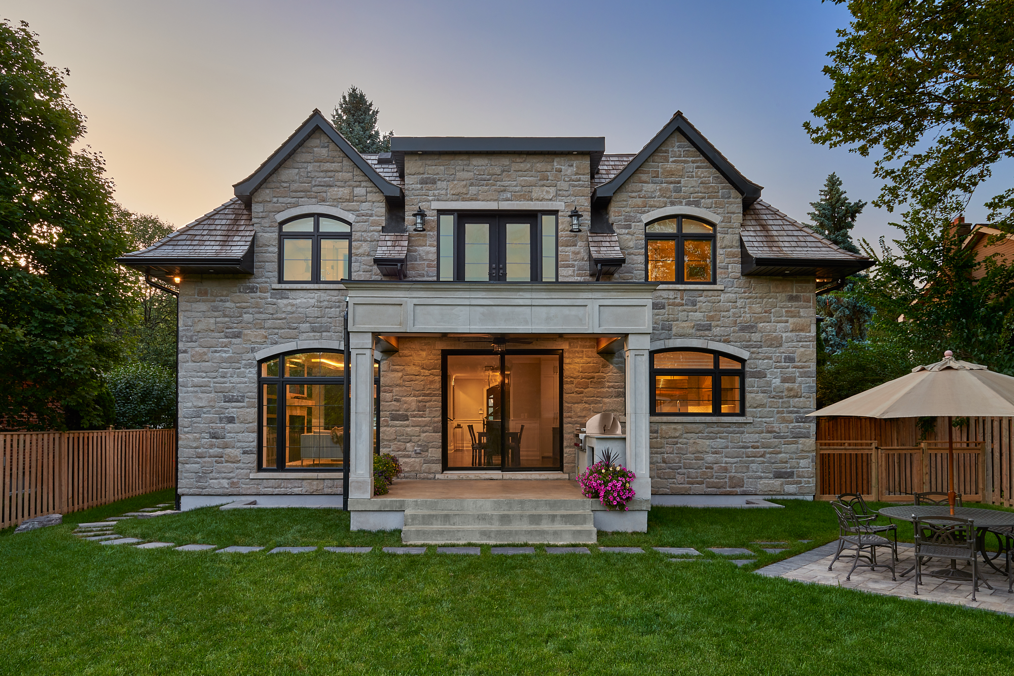 Rear elevation of the English Cottage opening to its landscaped garden