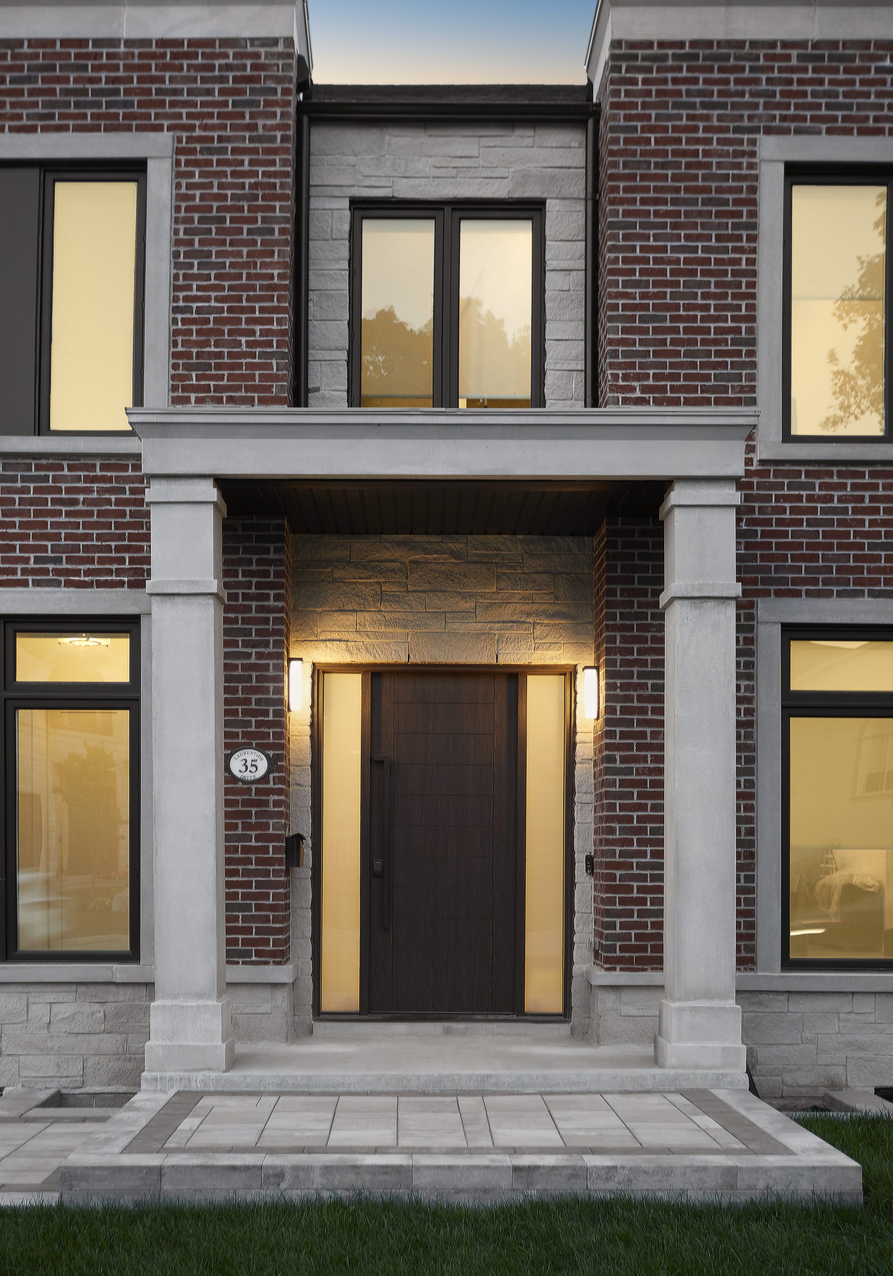 Limestone entrance and dark brick facade of the Donalda Georgian
