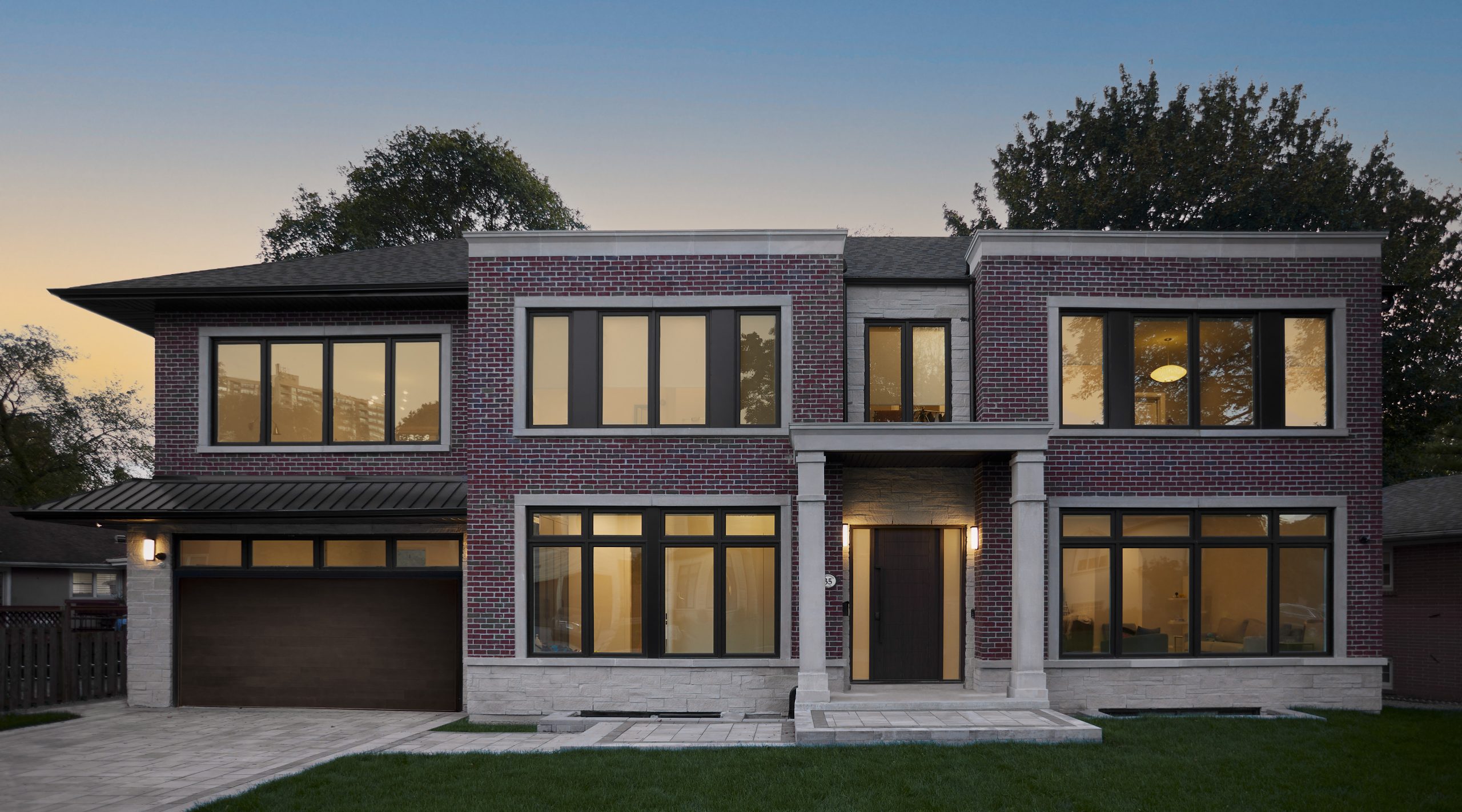 Donalda Georgian residence with symmetrical limestone and dark brick facade