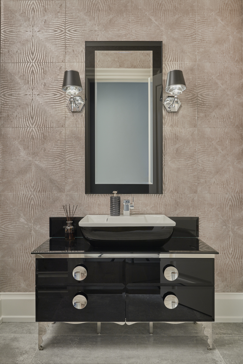 Powder room with dark stone vanity