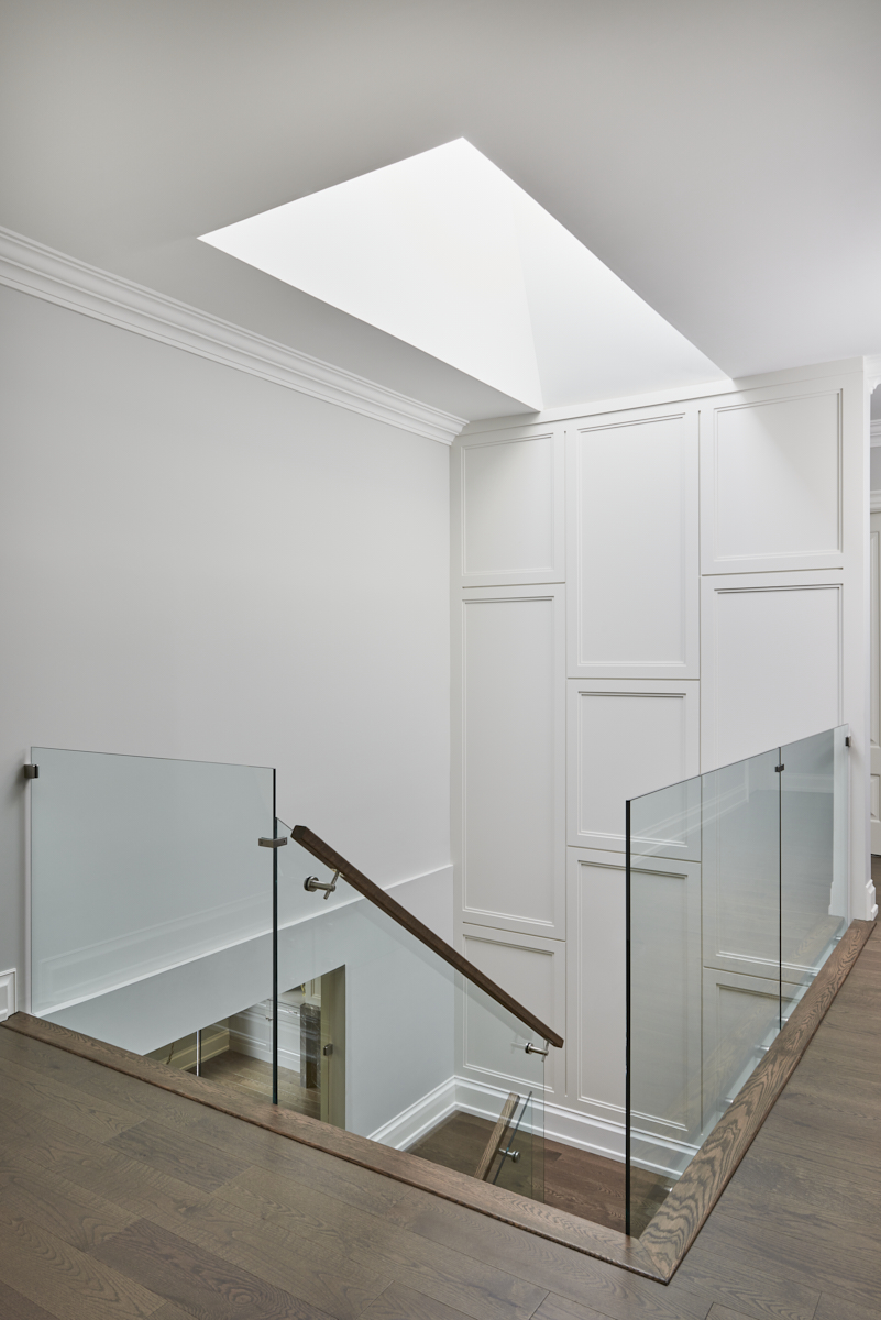 Bright stairwell with glass railing