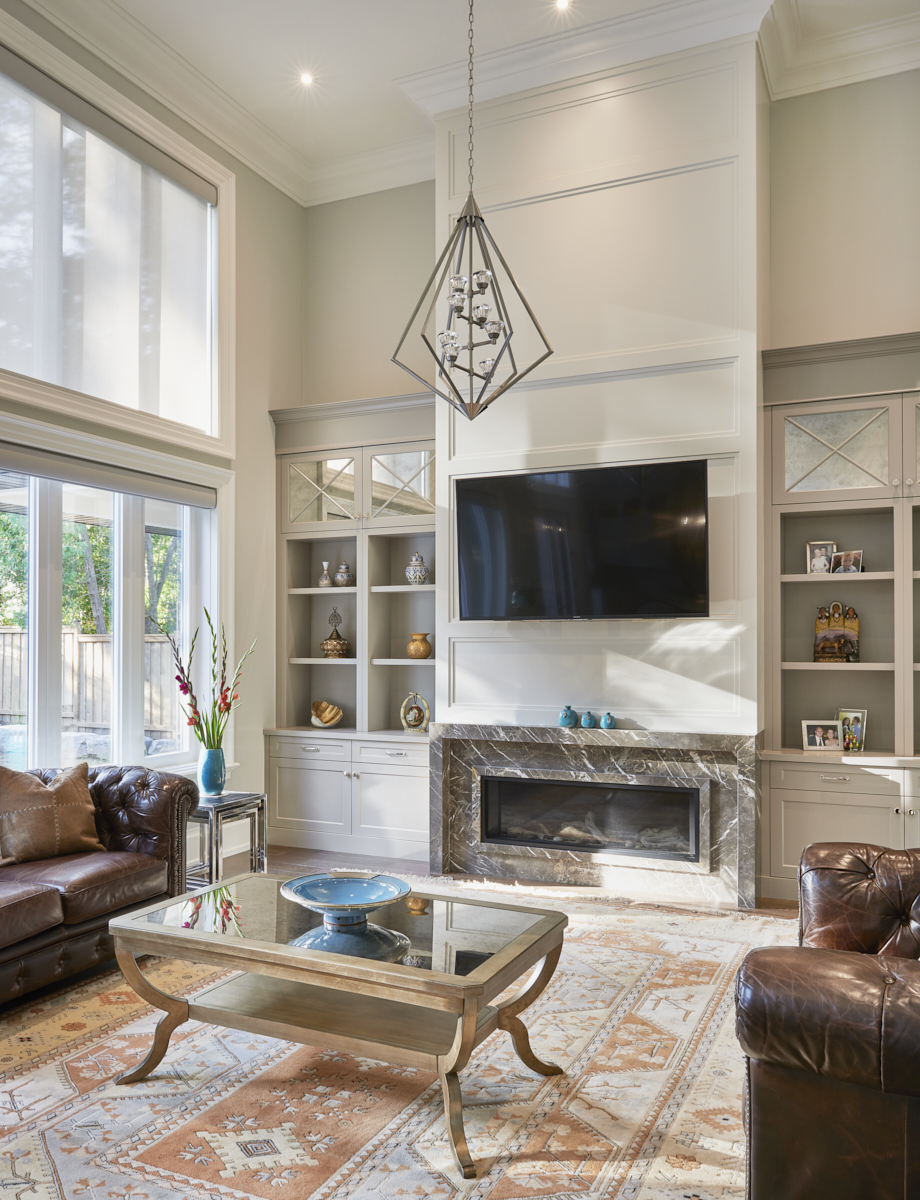 Warm white kitchen with arched range hood
