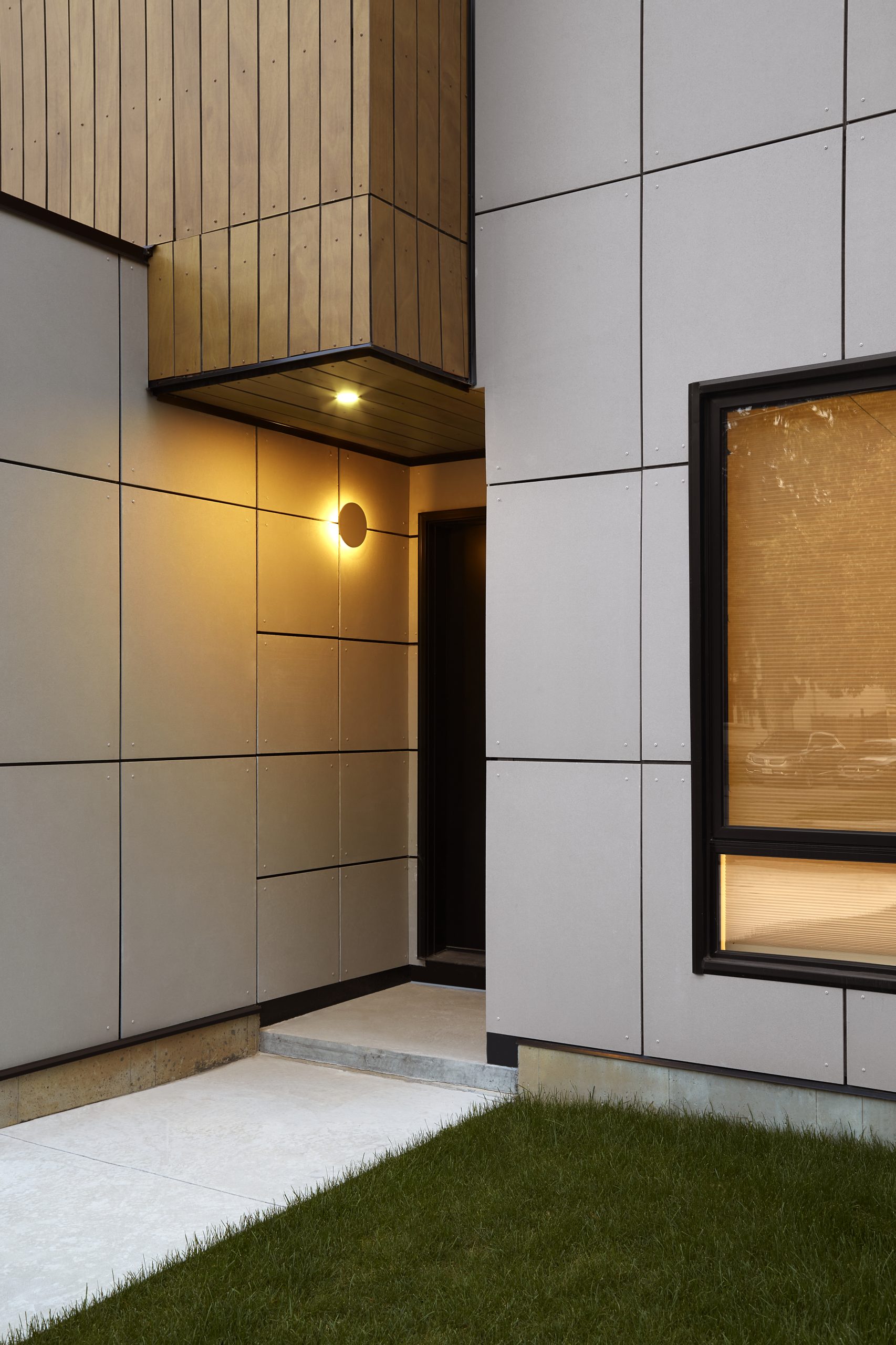 Recessed entrance between aluminum wall panels