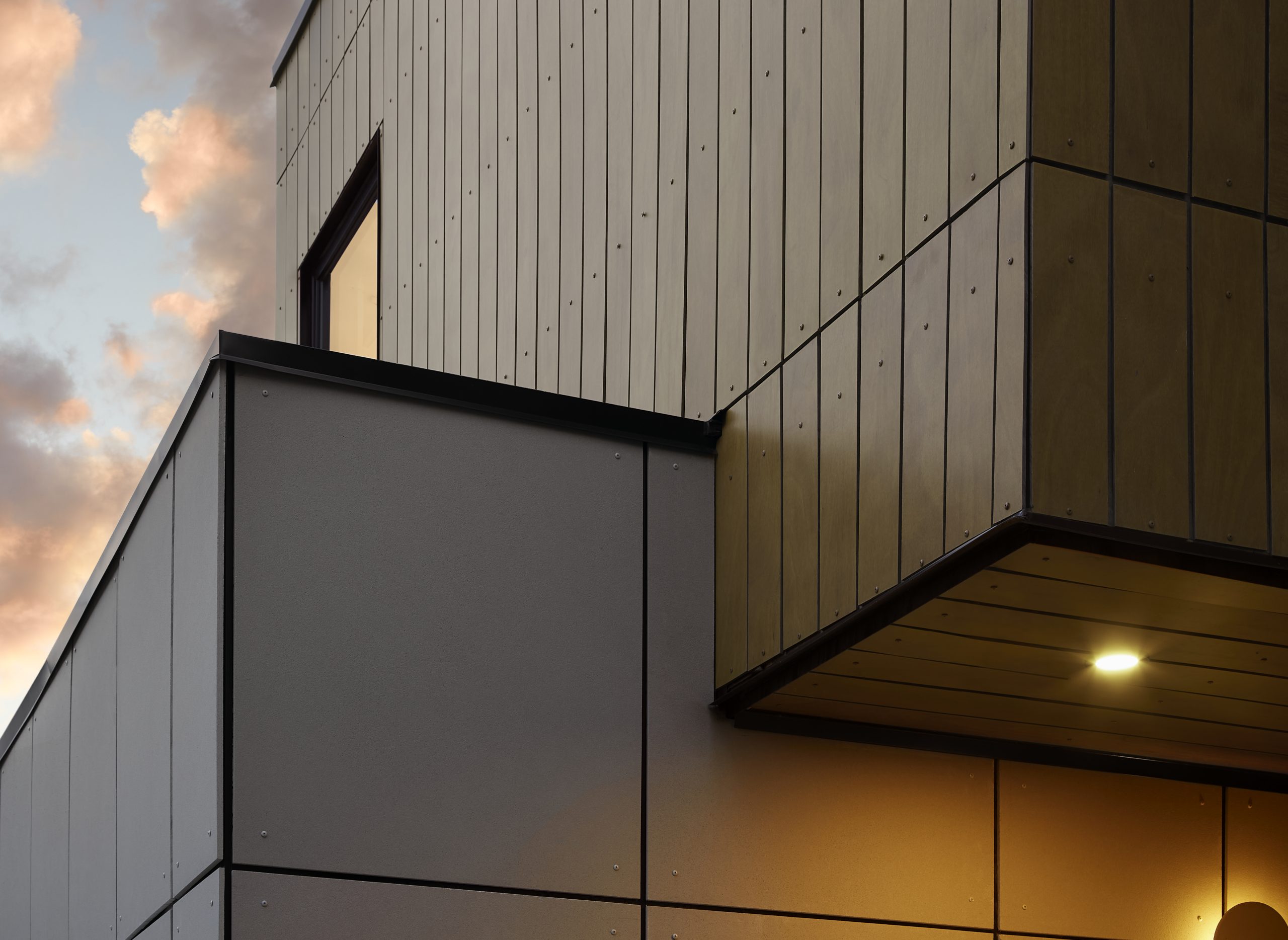 Warm wood and gray aluminum cladding detail