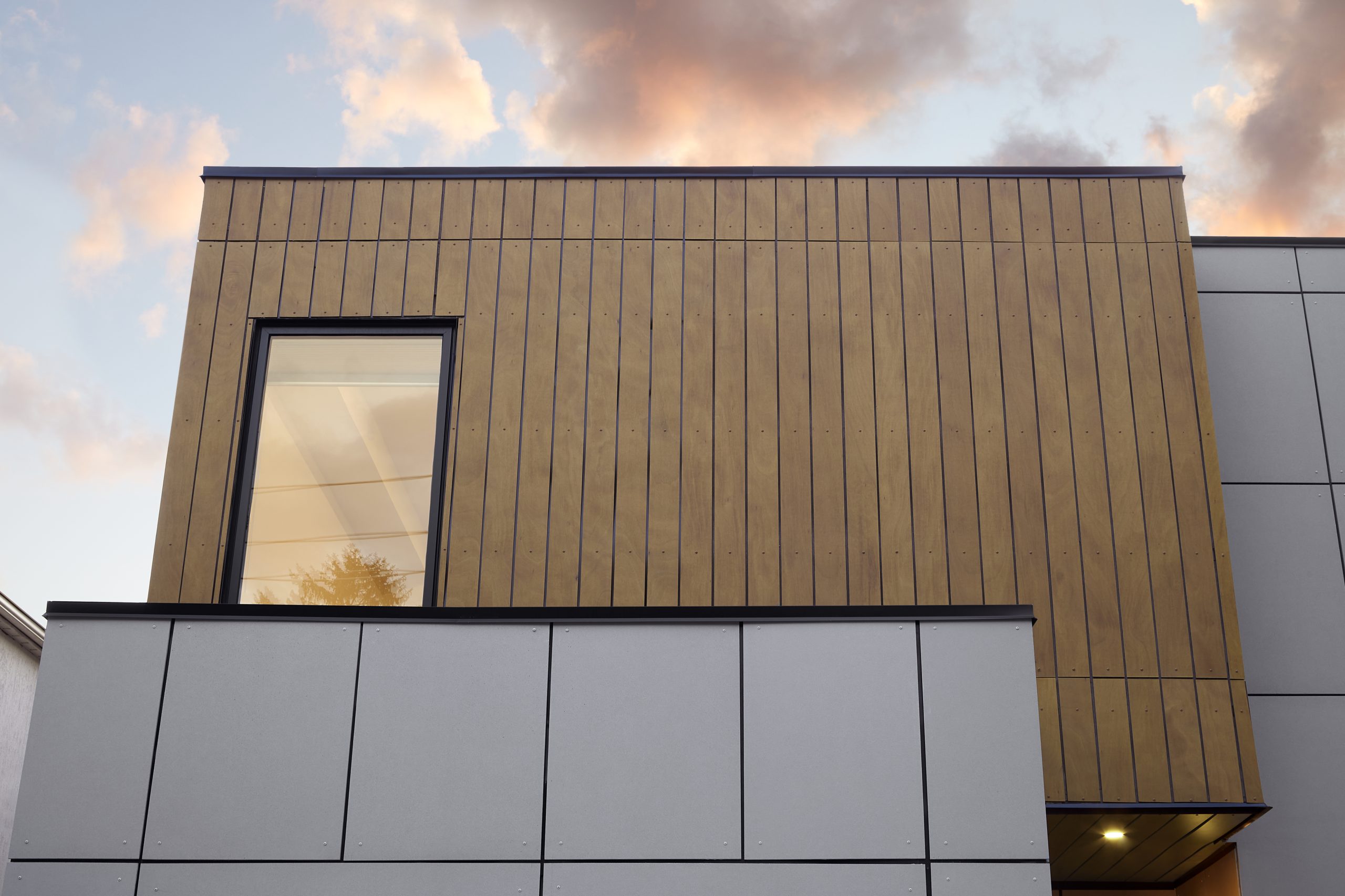 Close view of the warm wood cladding and upper window