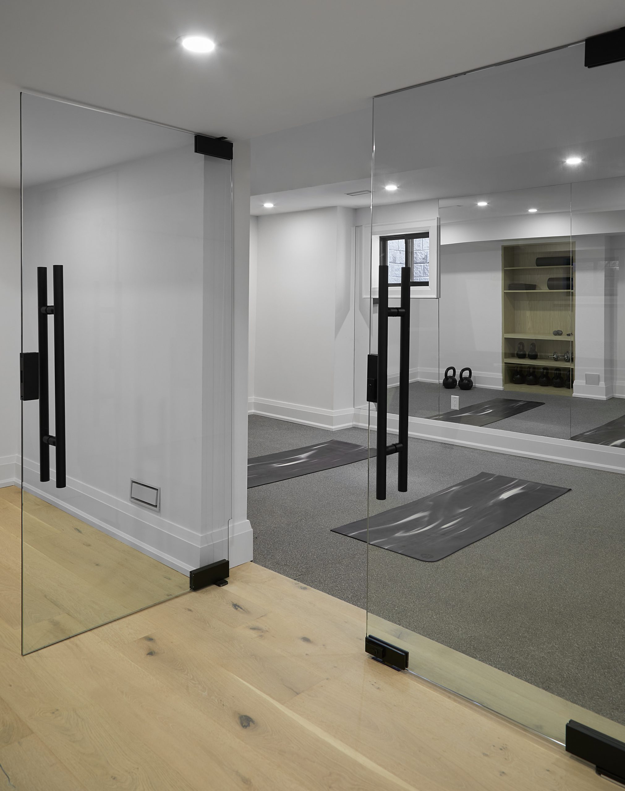 Home gym with mirrored walls