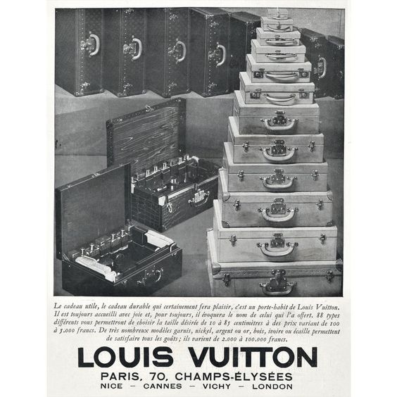 Black-and-white Louis Vuitton advertisement showing stacked luggage and trunks