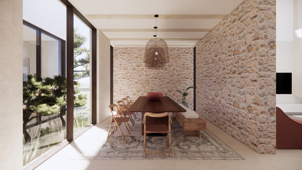 Sunlit dining room with a textured stone wall and floor-to-ceiling garden windows