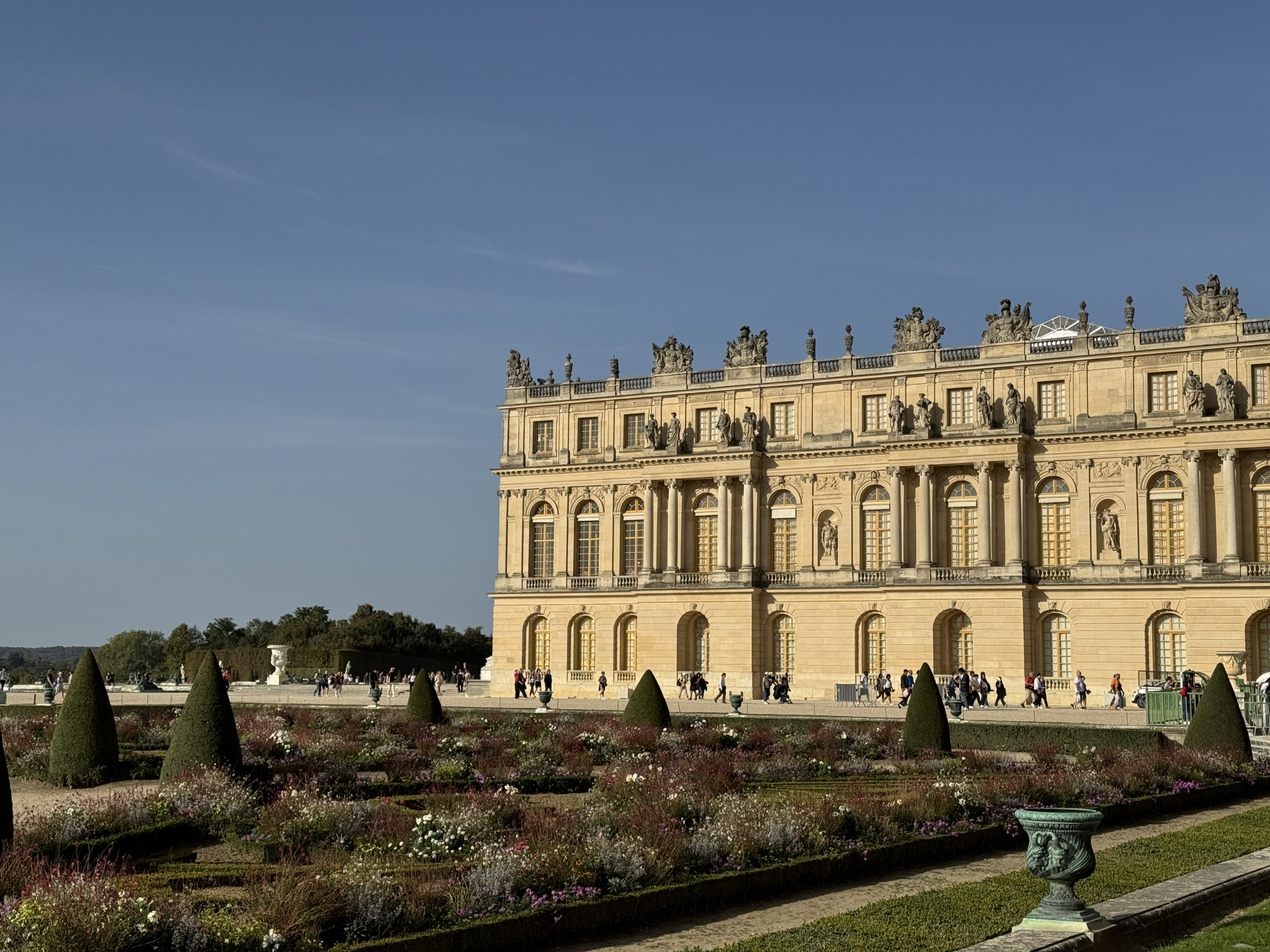Palace exterior overlooking geometrically arranged formal gardens