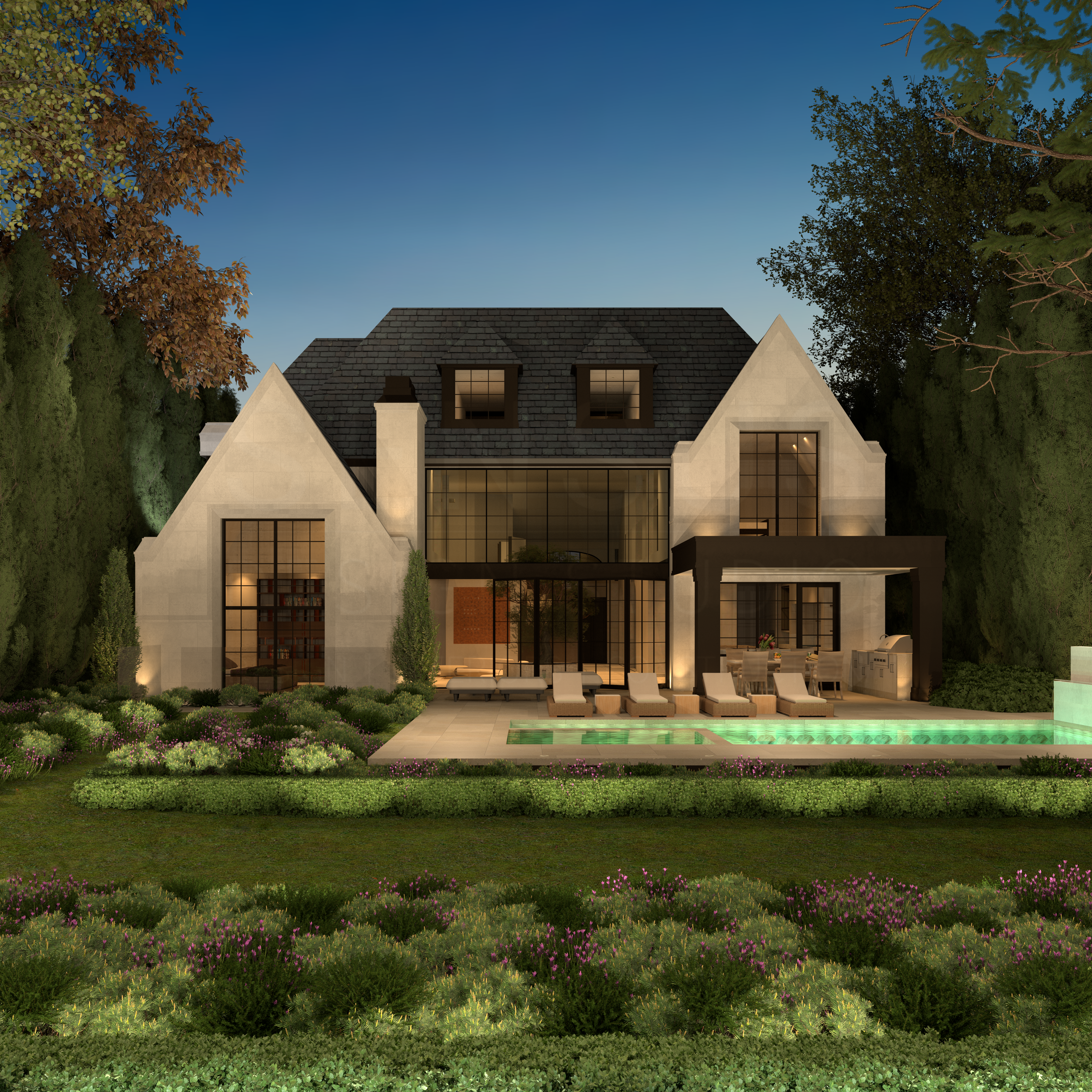 Rear facade and garden of the Tudor Revival illuminated at night