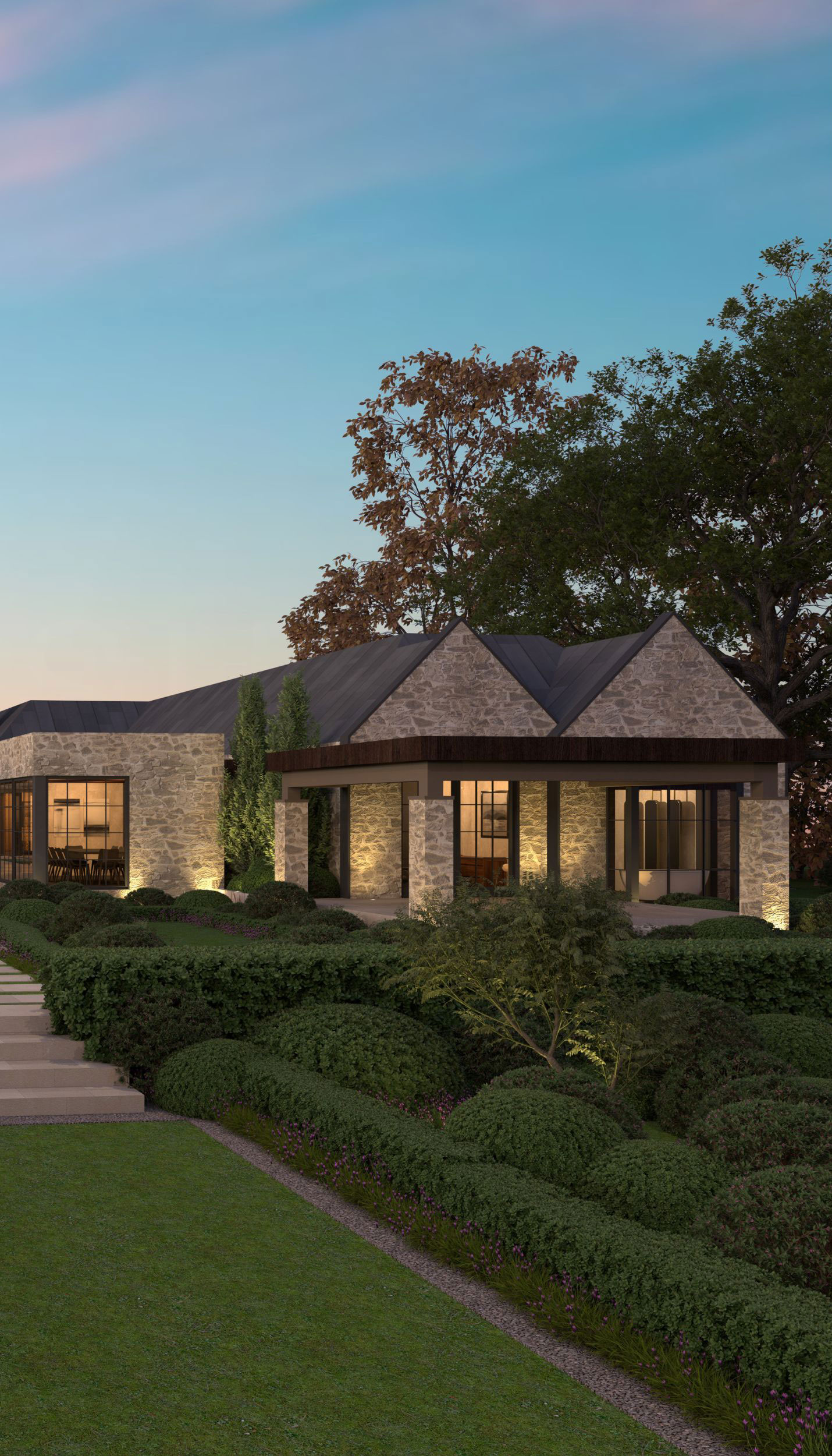 Low stone home beside clipped garden planting
