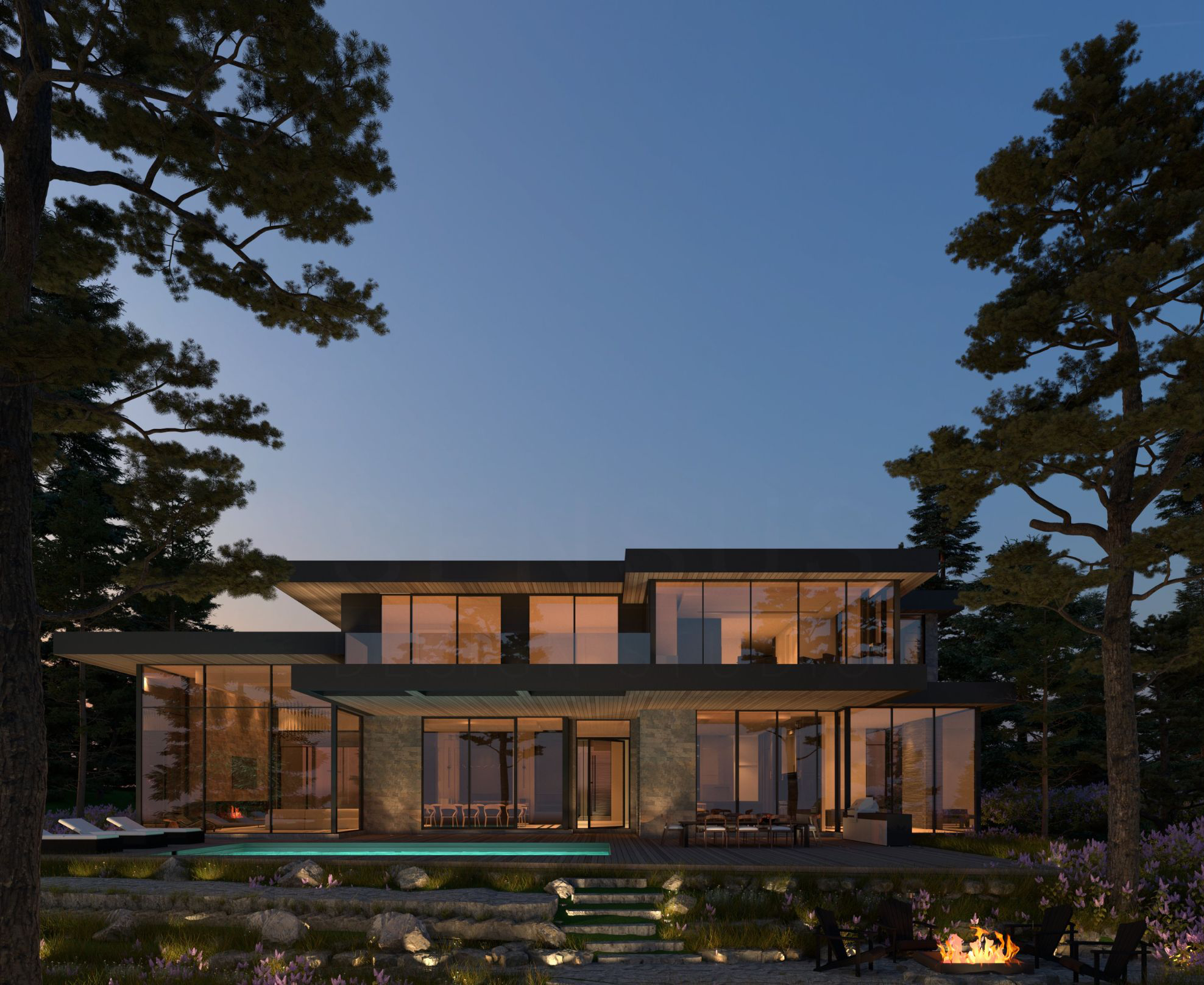 Illuminated contemporary home framed by trees