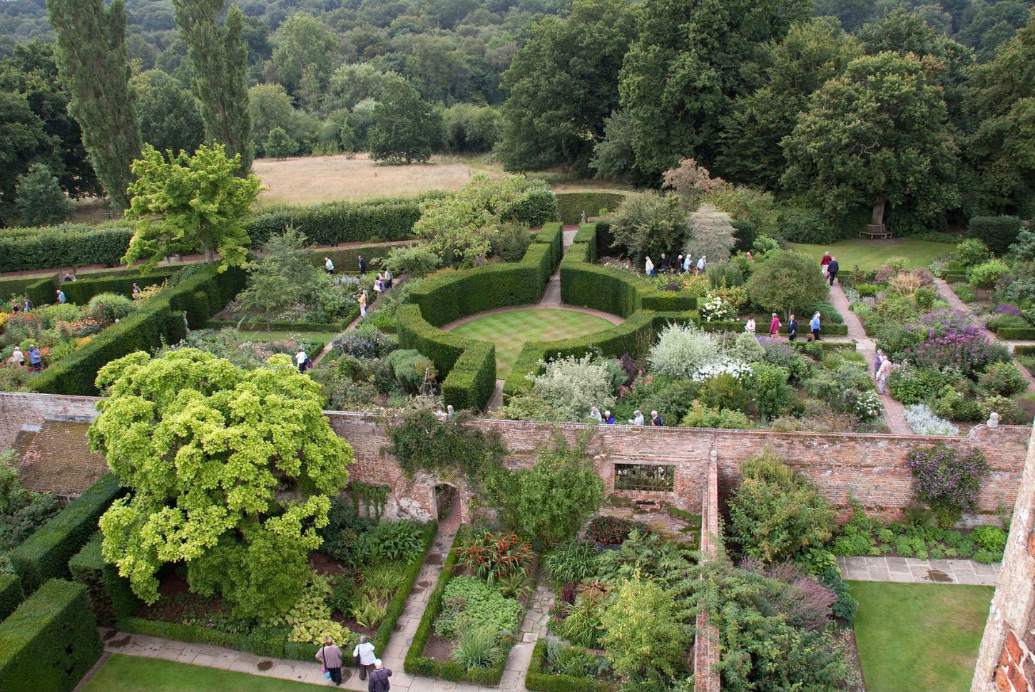 Flowering cottage garden divided by narrow paths