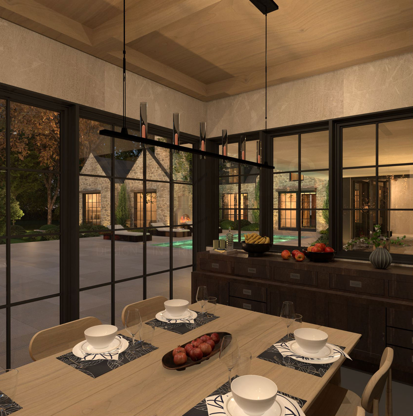 Dining table beside glazed doors and a kitchen