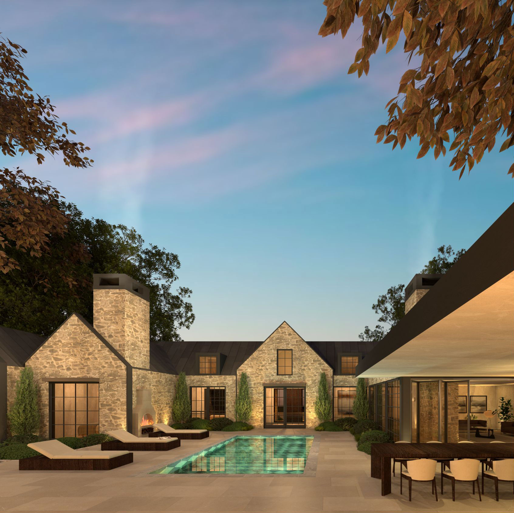 Stone buildings around an illuminated courtyard pool