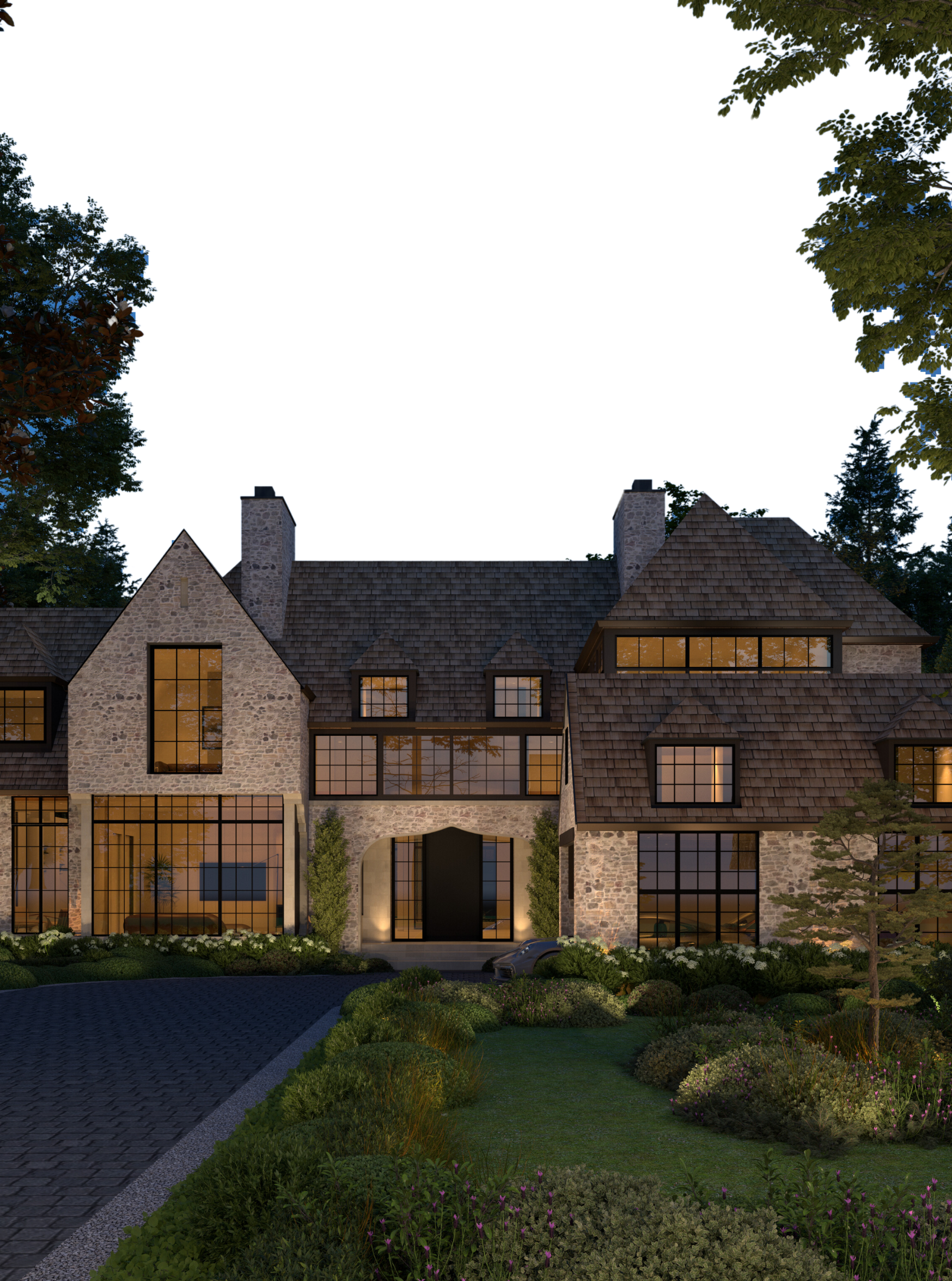 Stone home with dormer windows beside a landscaped drive
