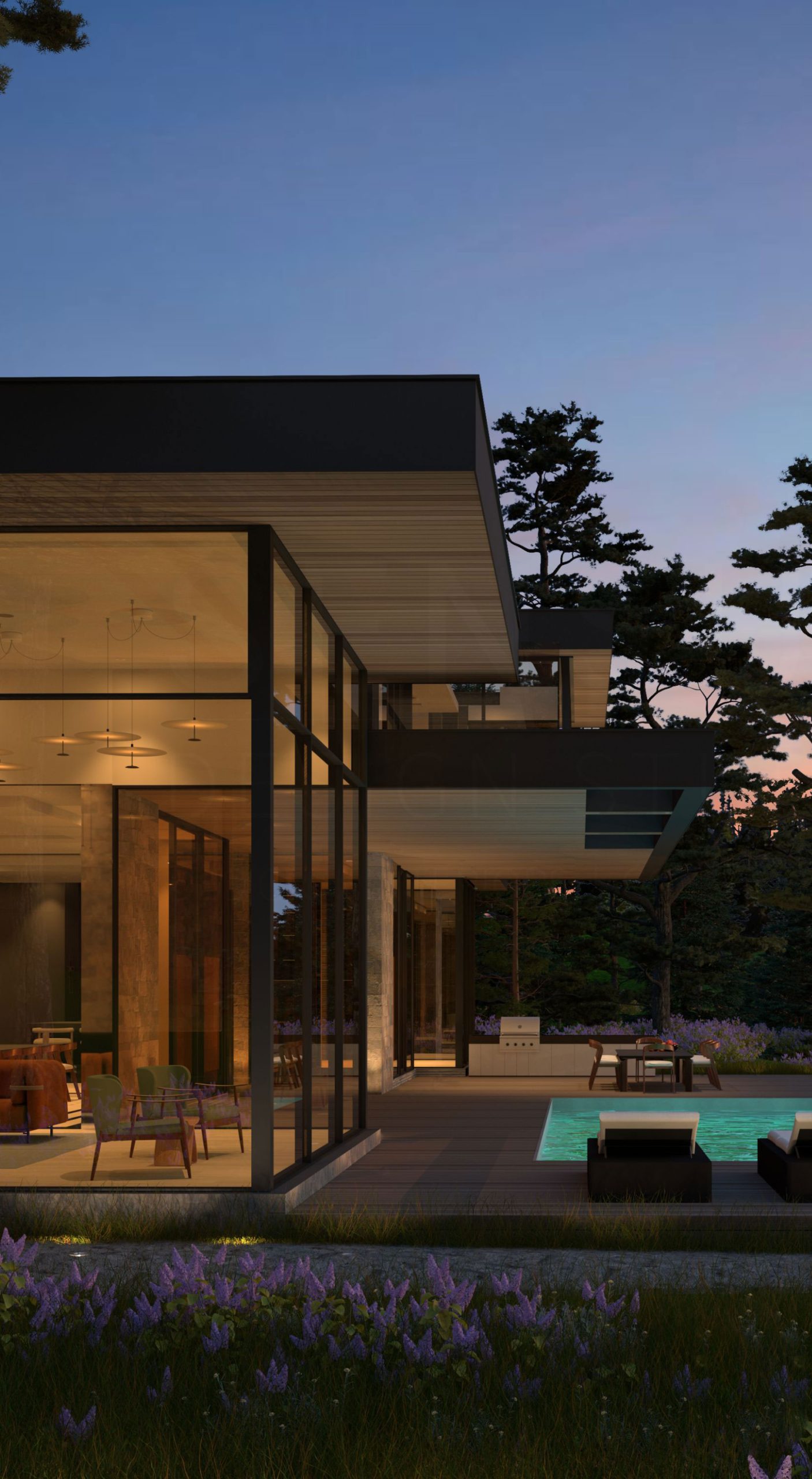 Illuminated contemporary glass facade beside a pool