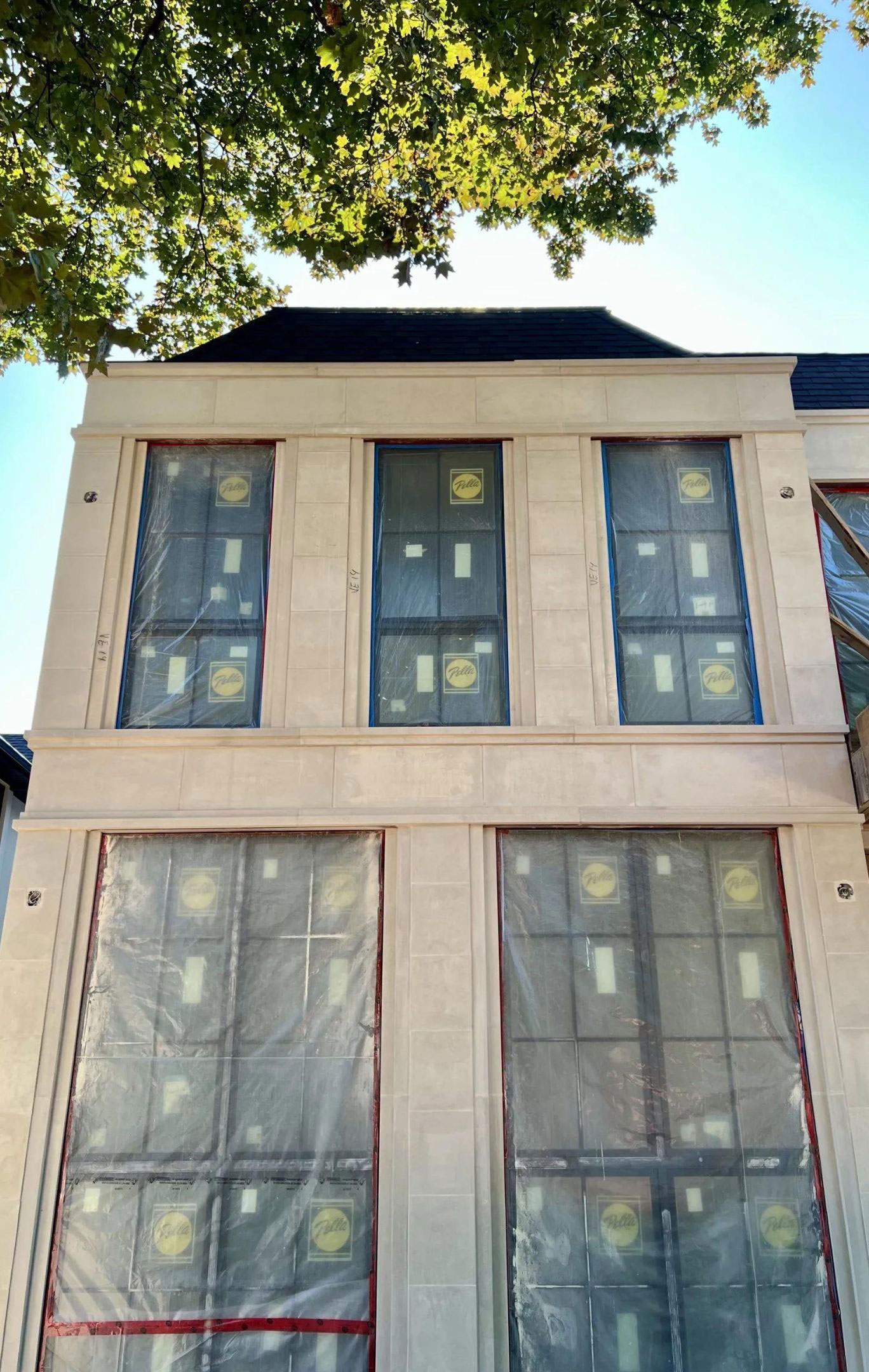 Stepped stone surrounds framing tall windows