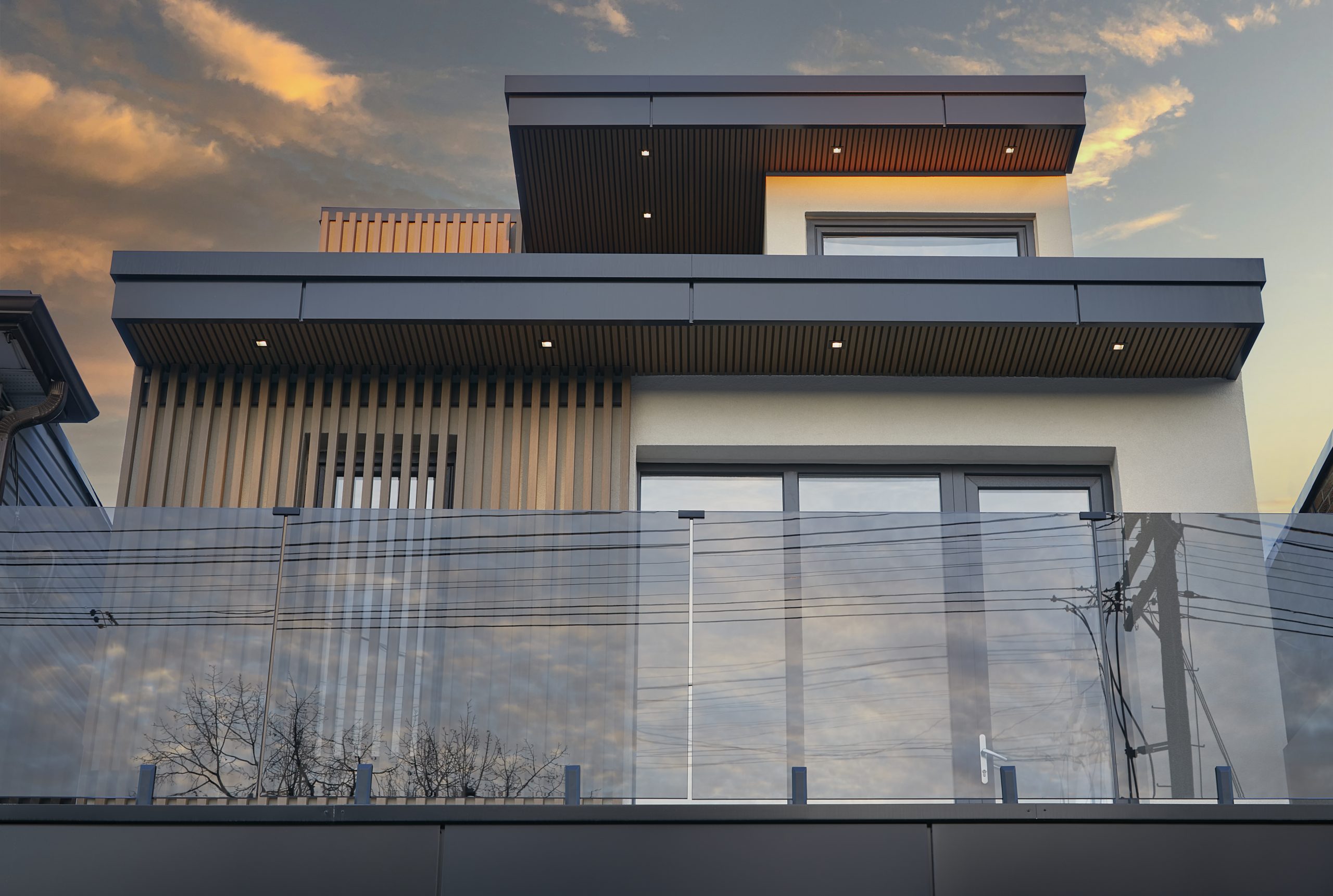 Upper terrace and fluted wood details of the Queen West compound