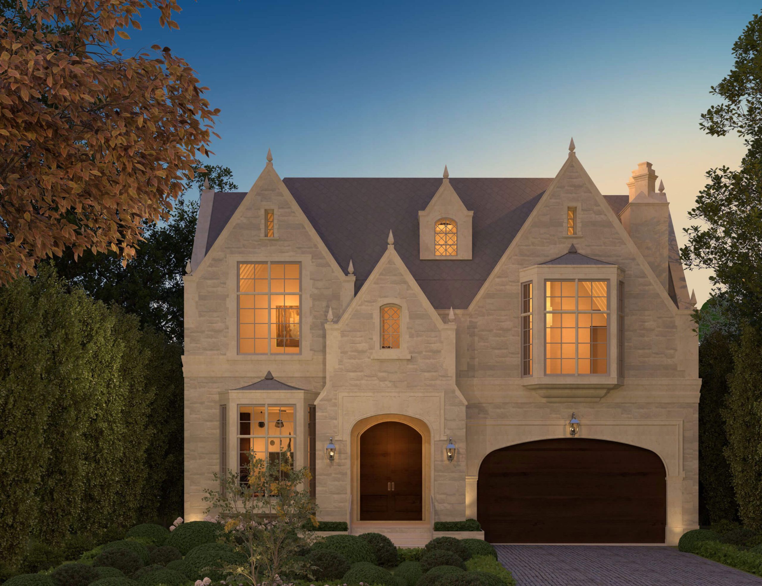 Traditional Tudor Revival with carved limestone facade at dusk