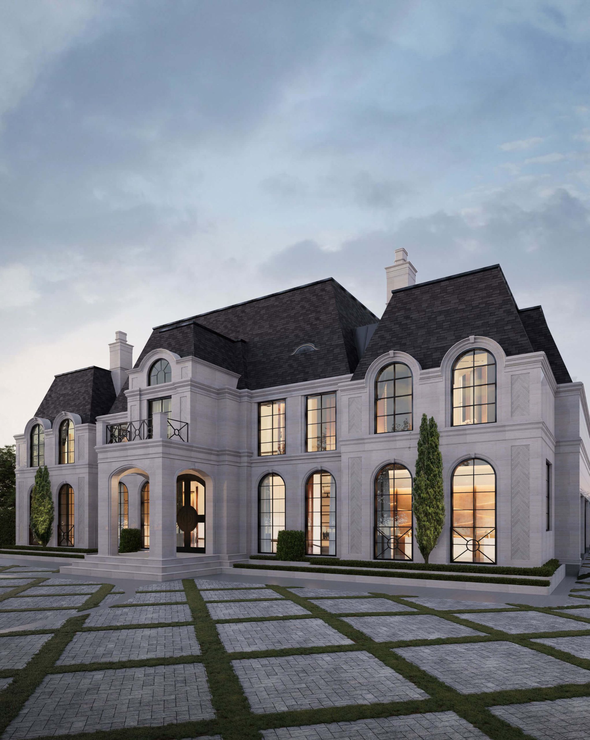 Steep roofline and limestone chimneys of the French Estate Home