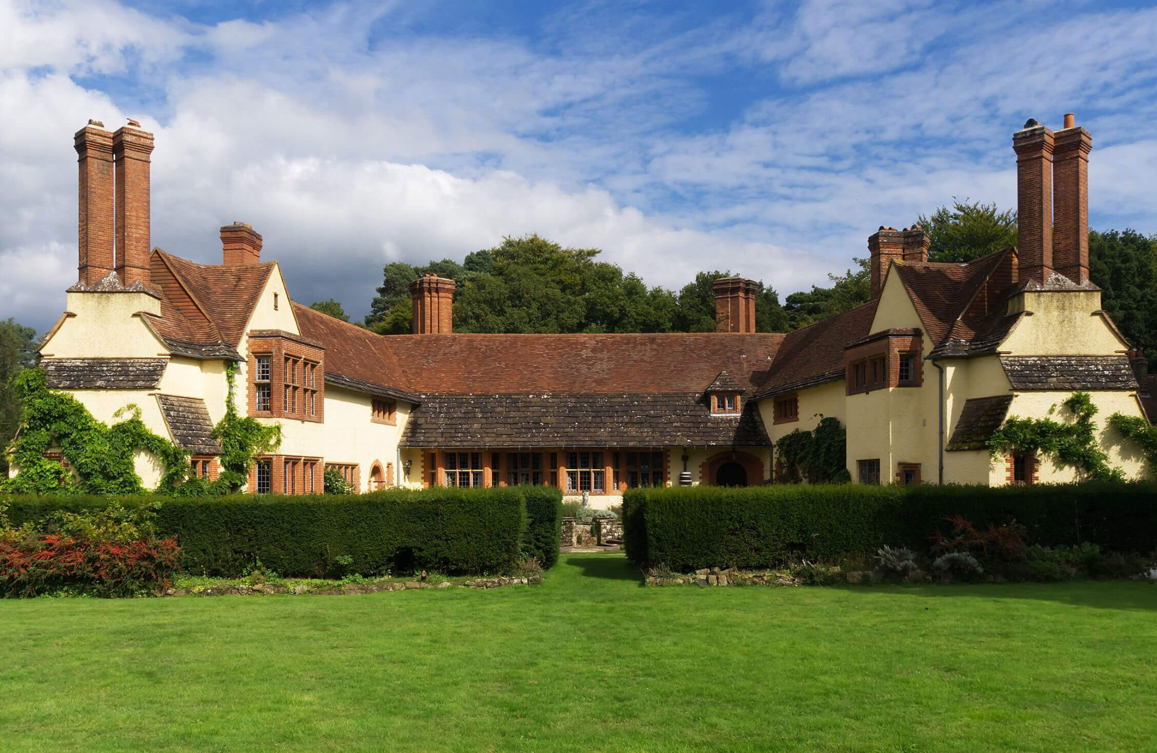 Country house arranged around a green lawn