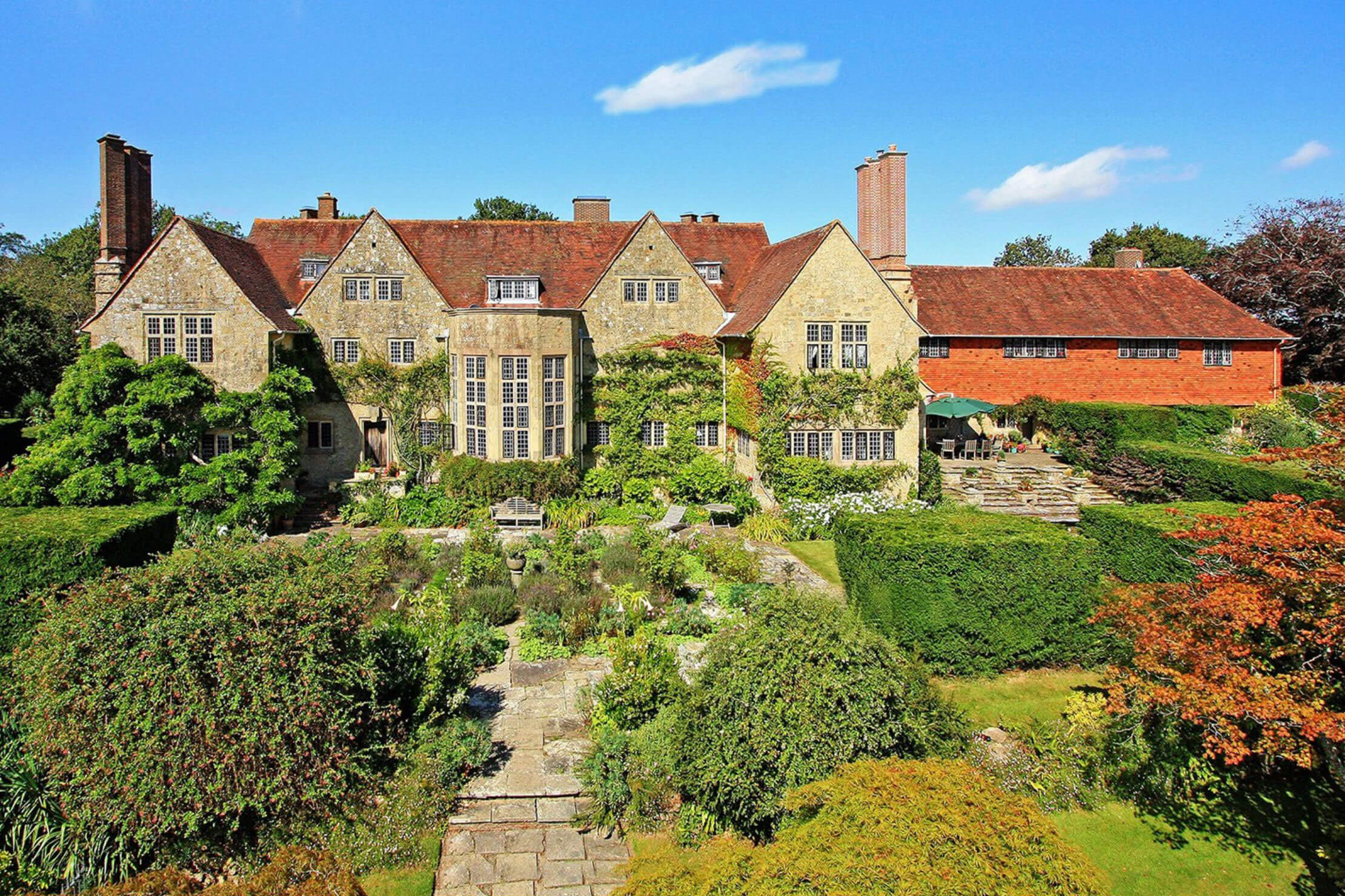 Country manor with gables and planted terraces