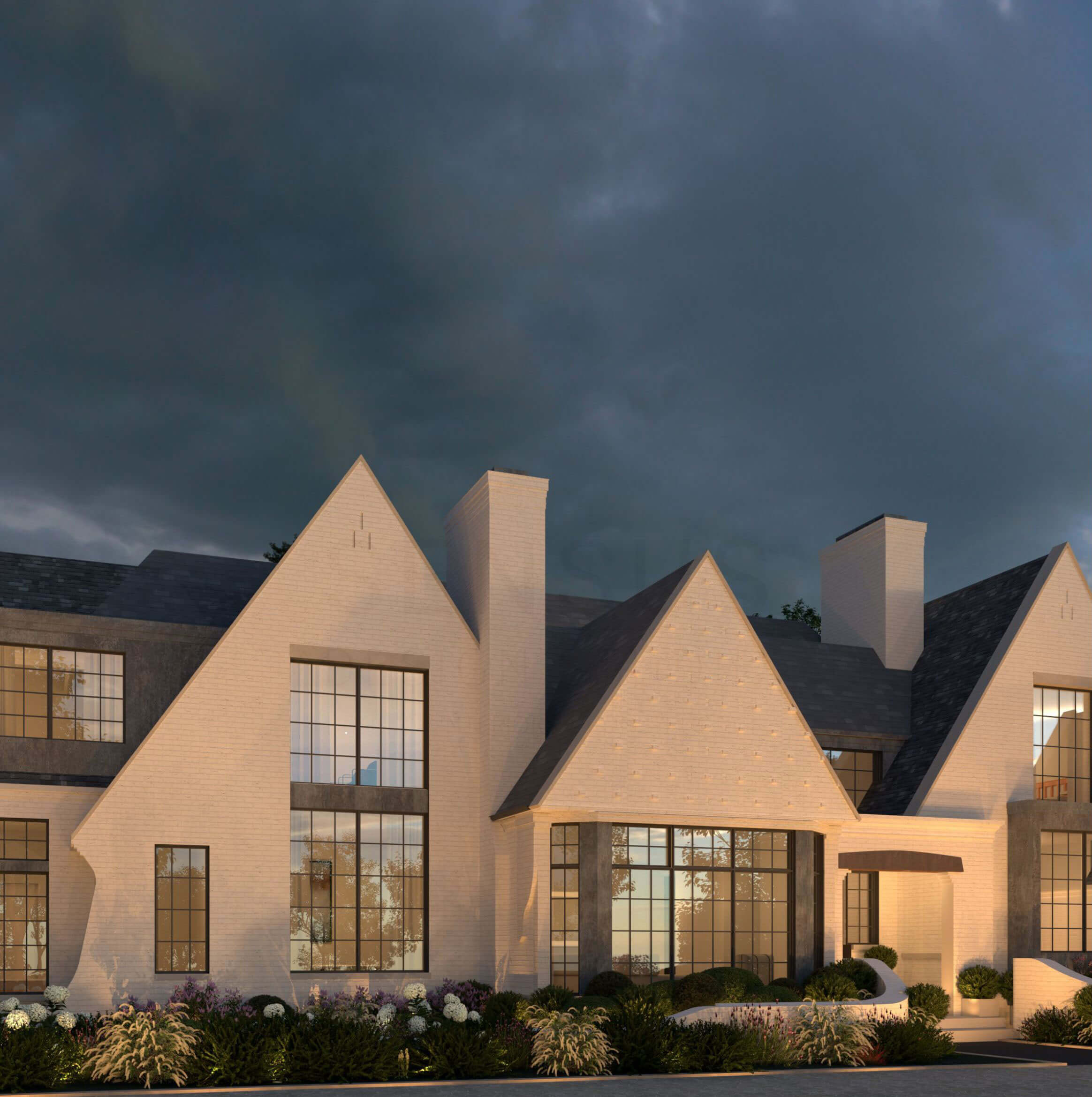 Curved masonry railings and detailed gable ends at the English Country home