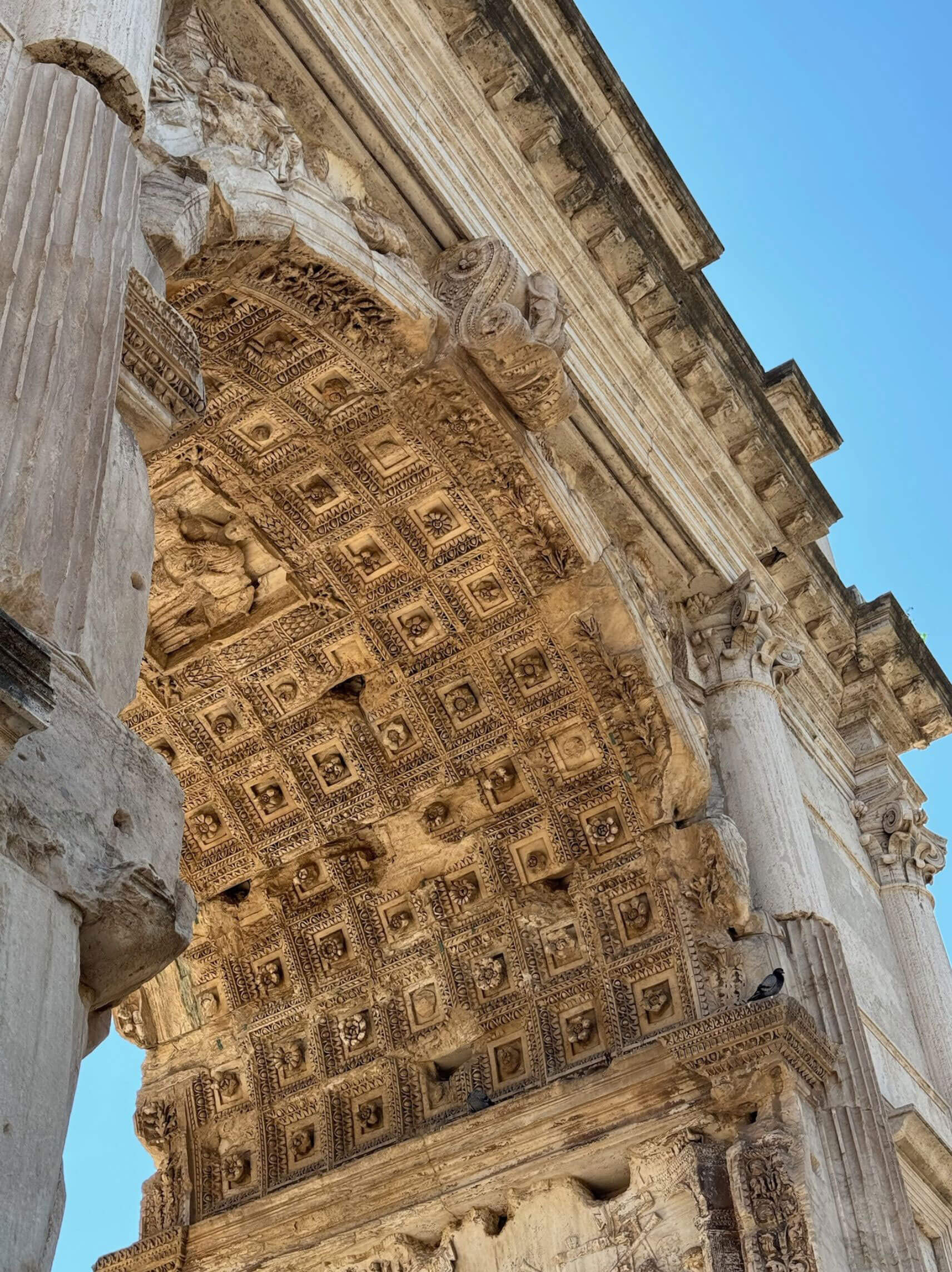 Deeply carved coffered underside of a triumphal arch
