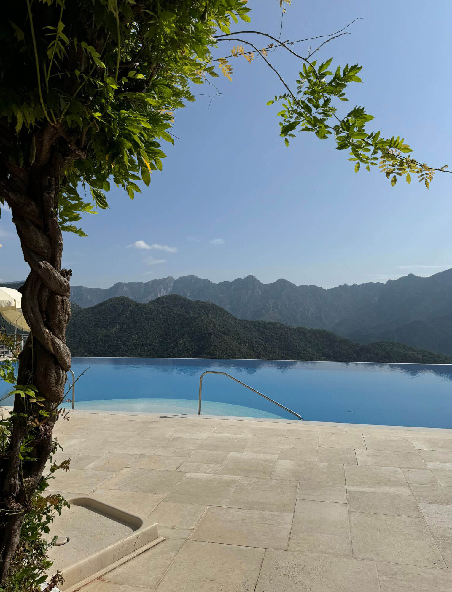 Infinity pool overlooking mountain ridges