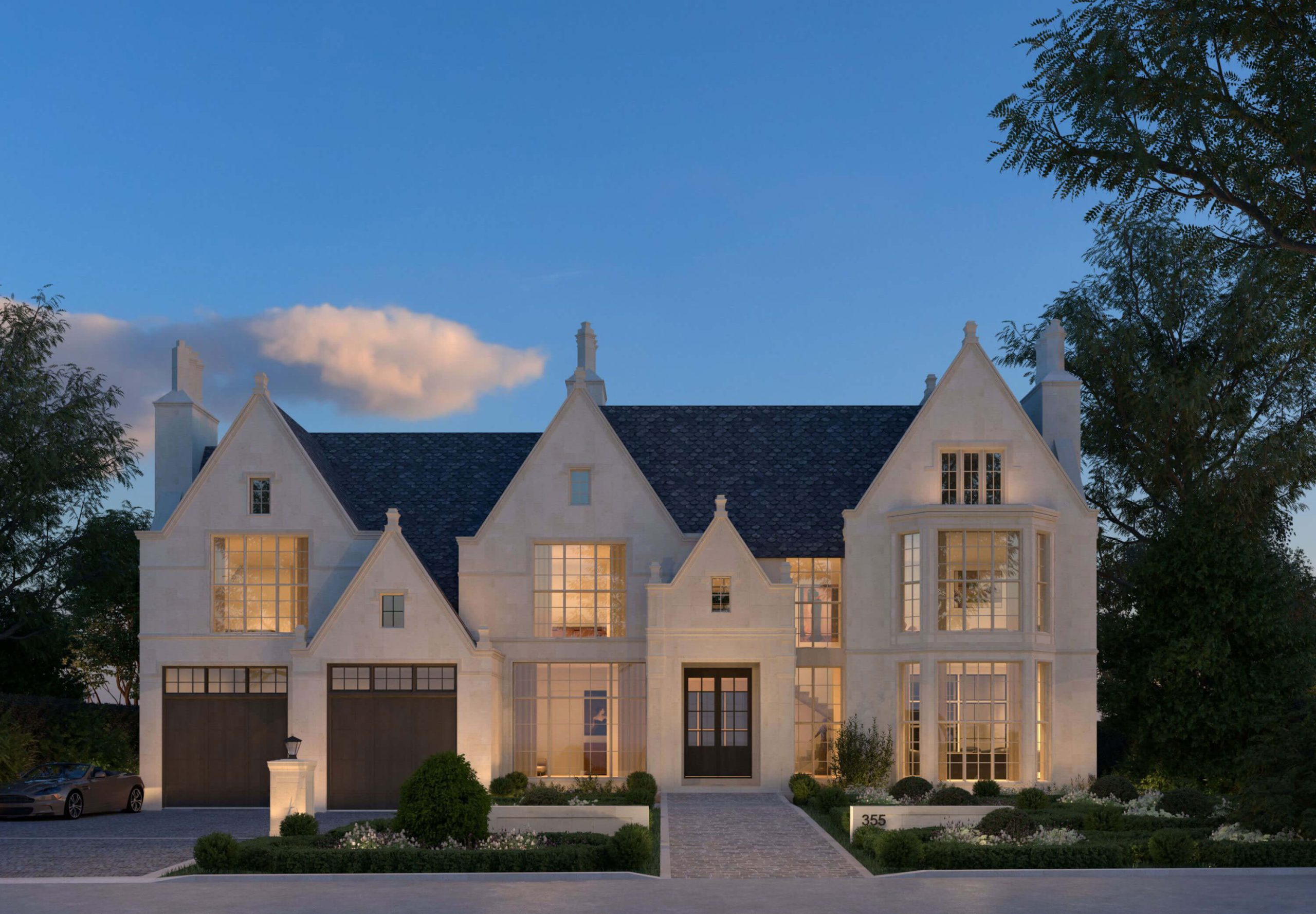 Tudor Revival Manor with limestone gables at twilight