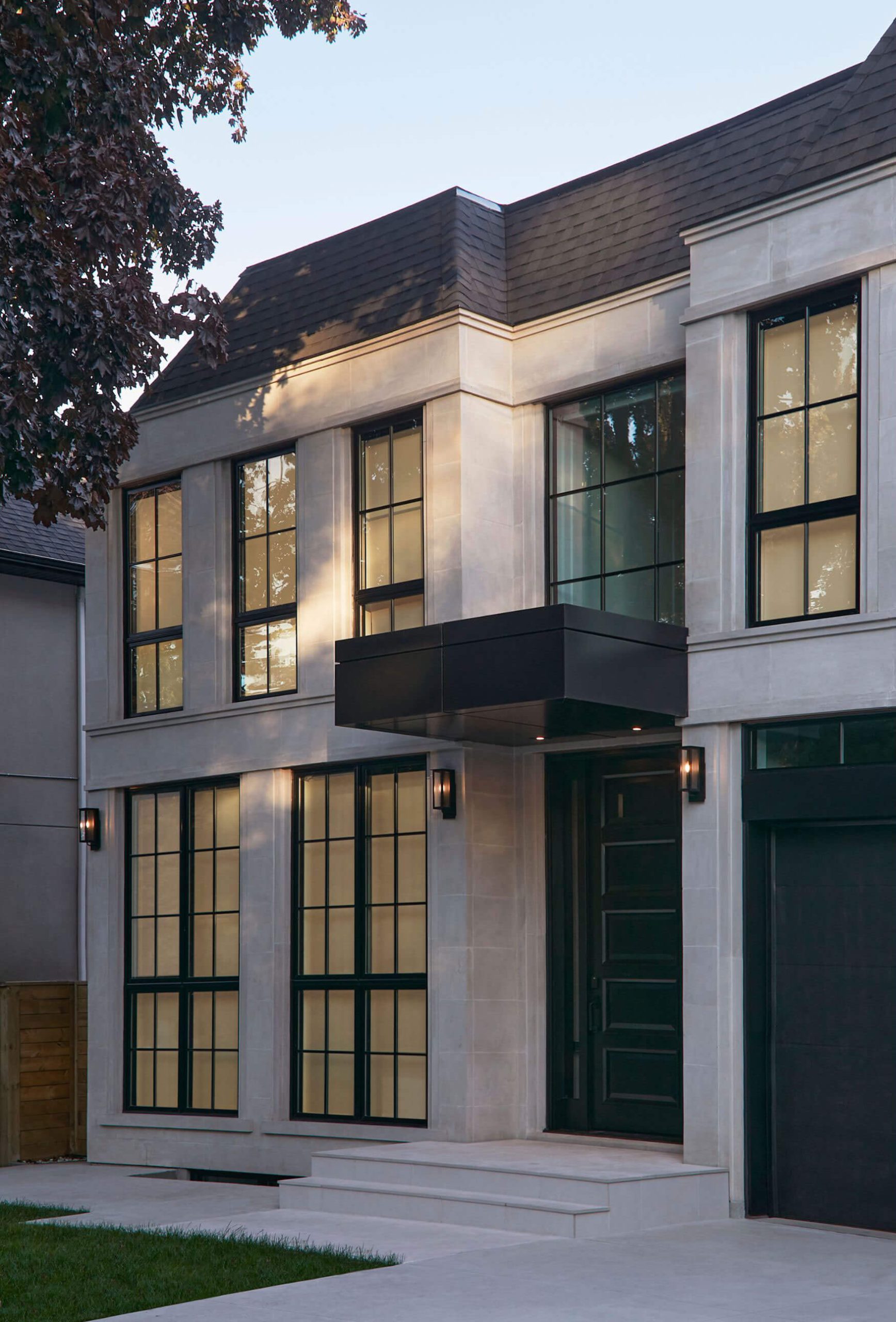 Limestone wall and contrasting black windows on the chateau facade