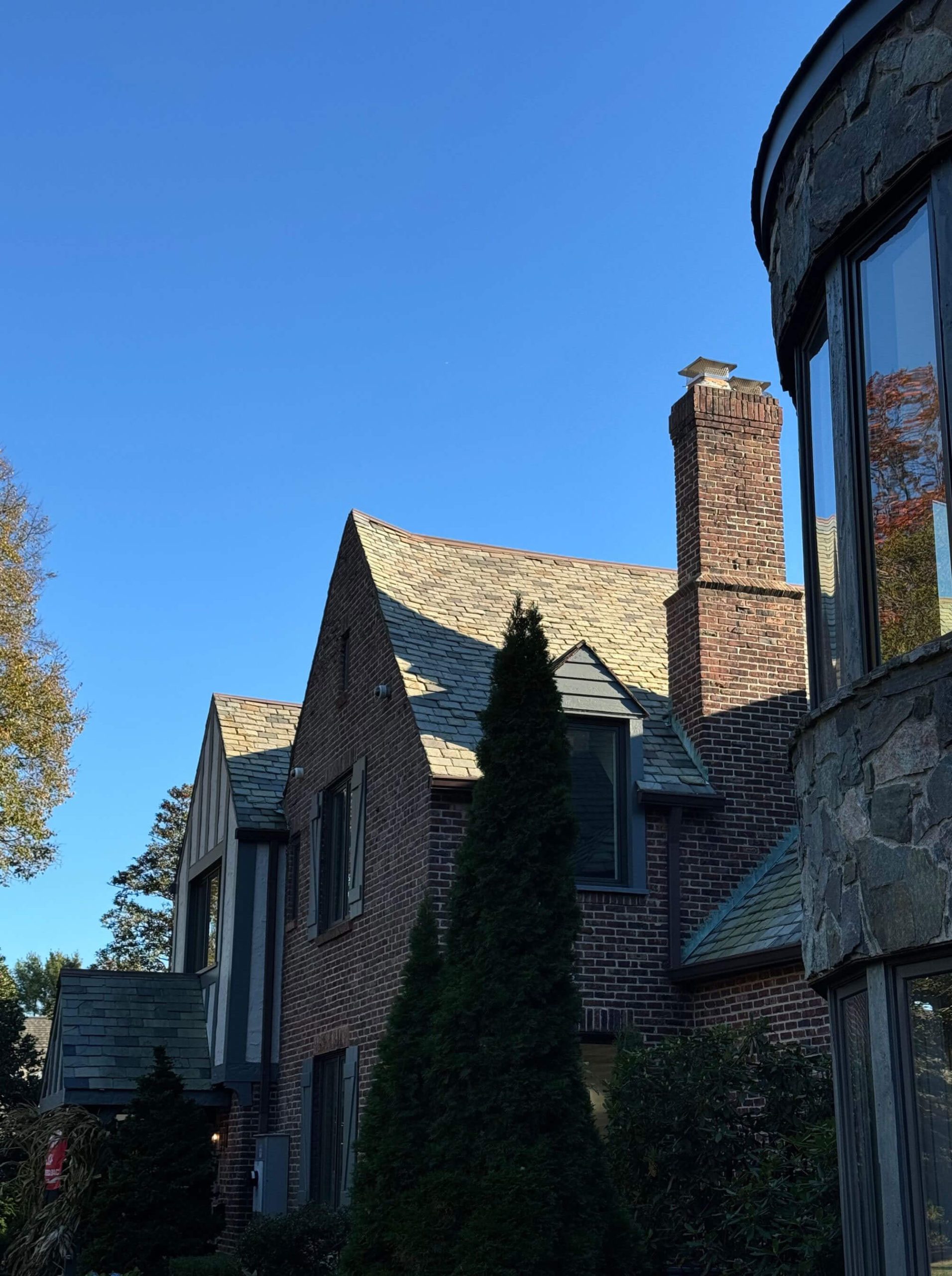 Bay Shore Manor facade blending limestone and red brick chimneys