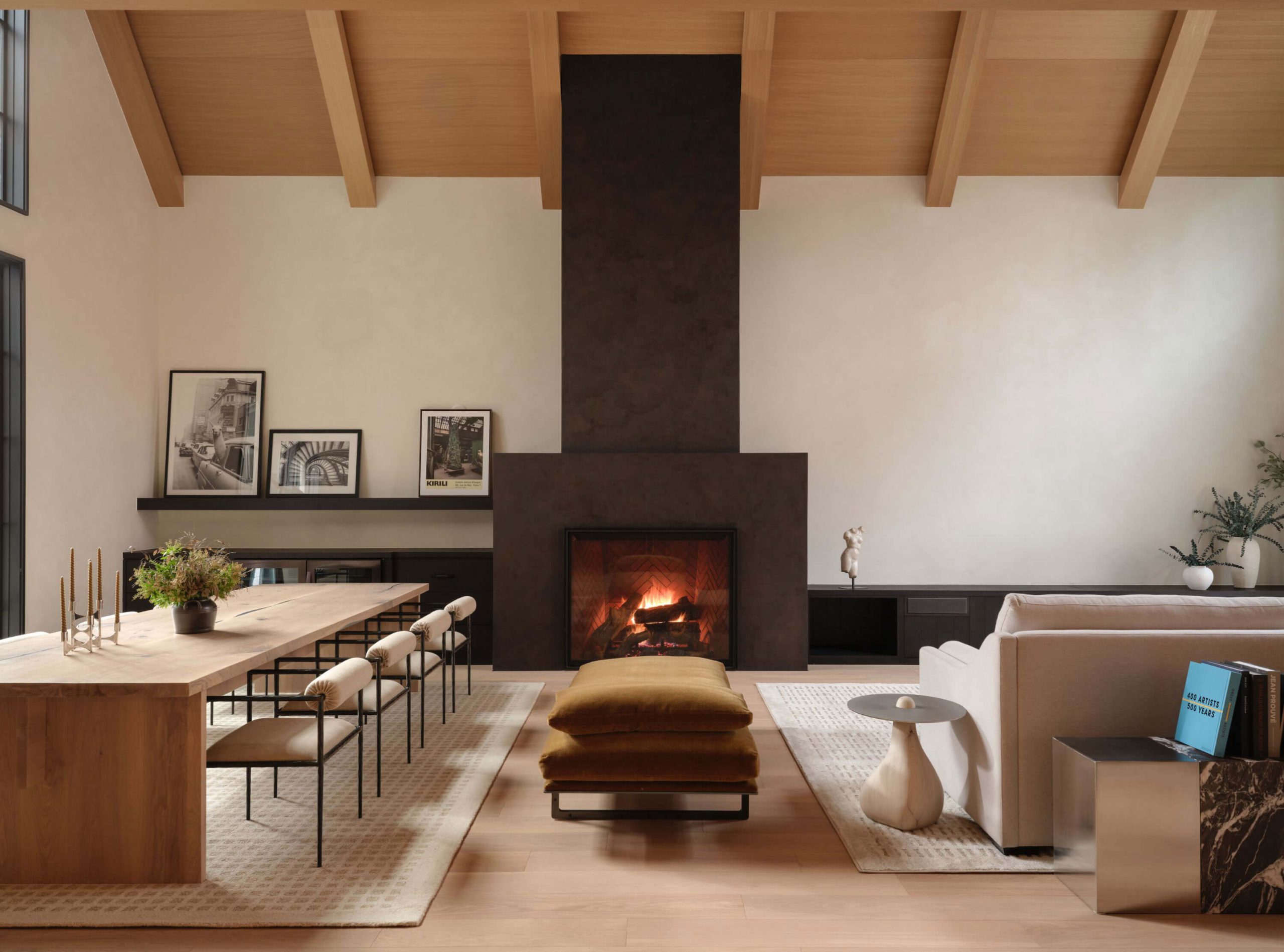 Vaulted great room with white oak ceilings and sculptural lighting