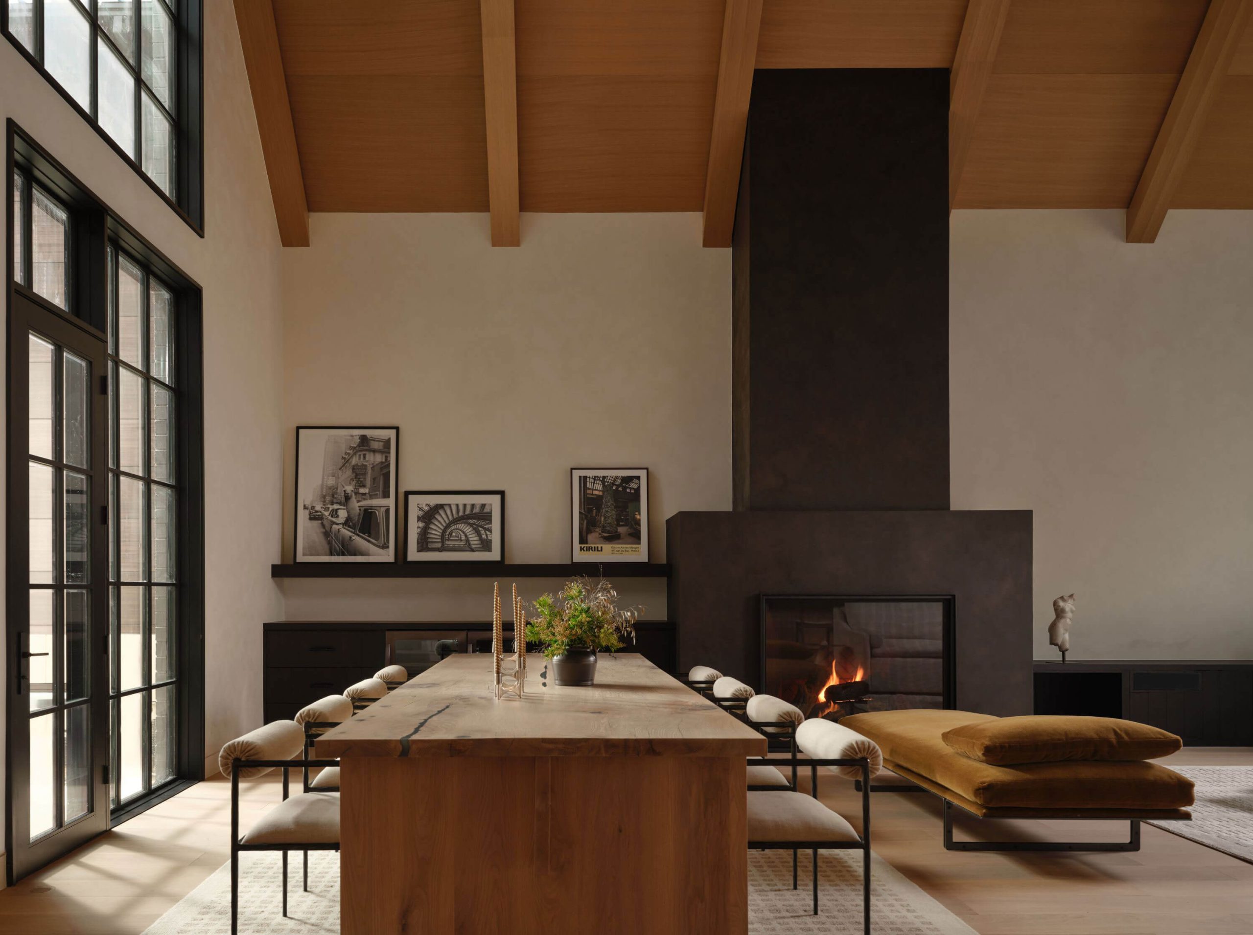 Open-concept great room centered on a full-height fireplace