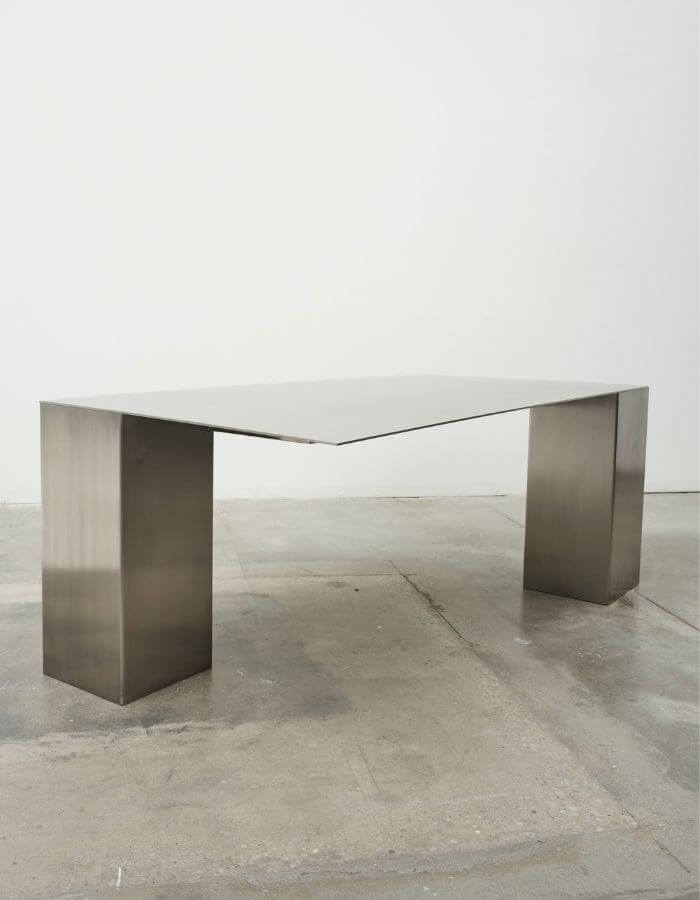 Minimalist metal sketching table with reflective steel legs