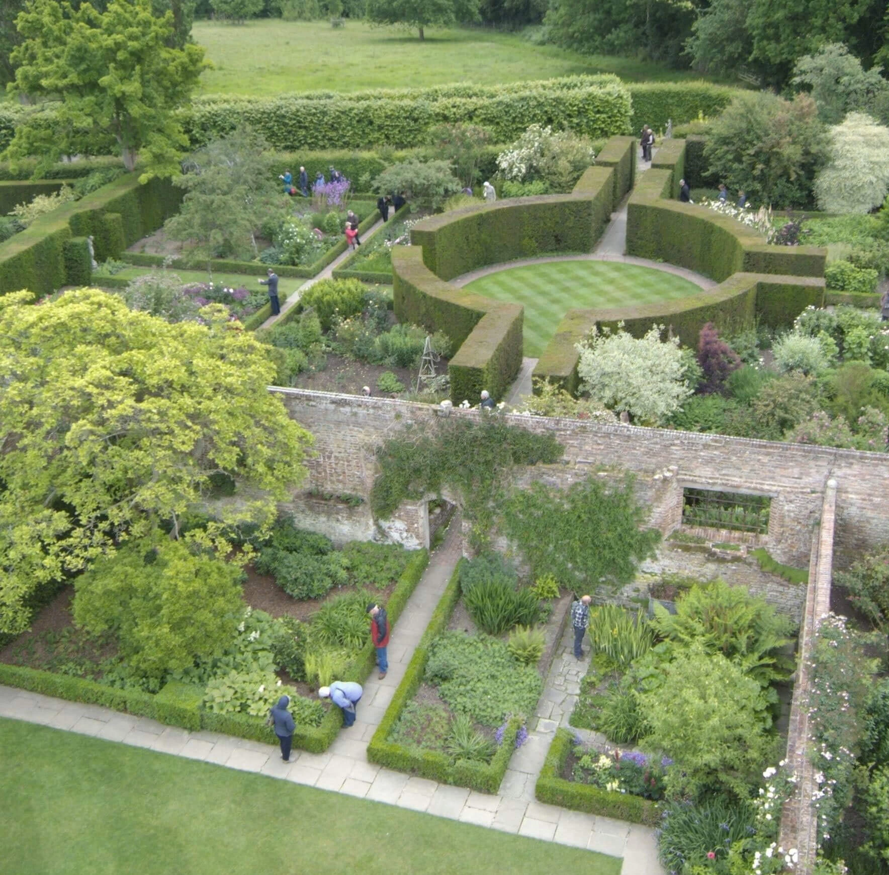 Overhead view of terraced gardens and geometric hedges