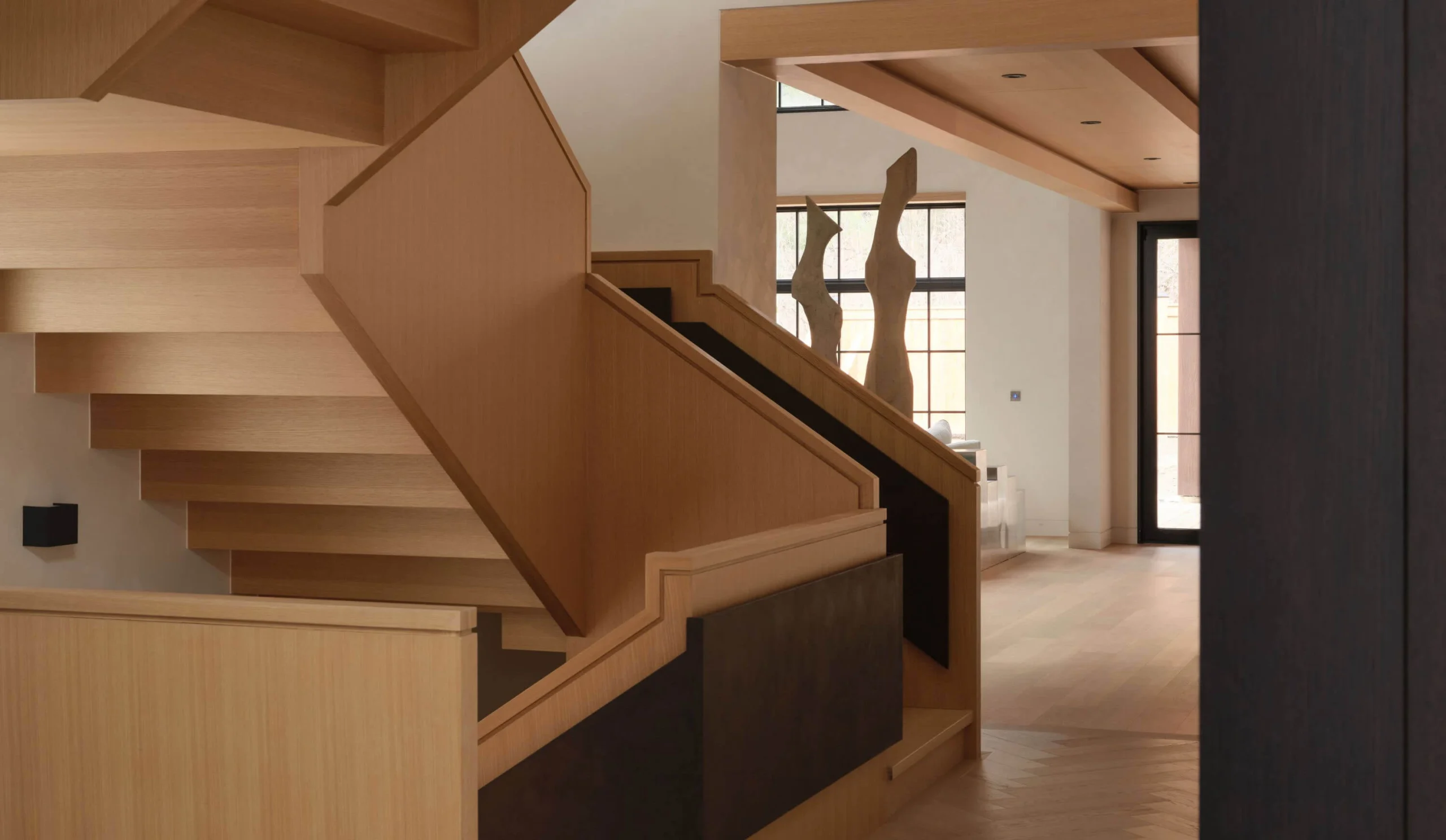 Sculptural timber staircase and curated interior details