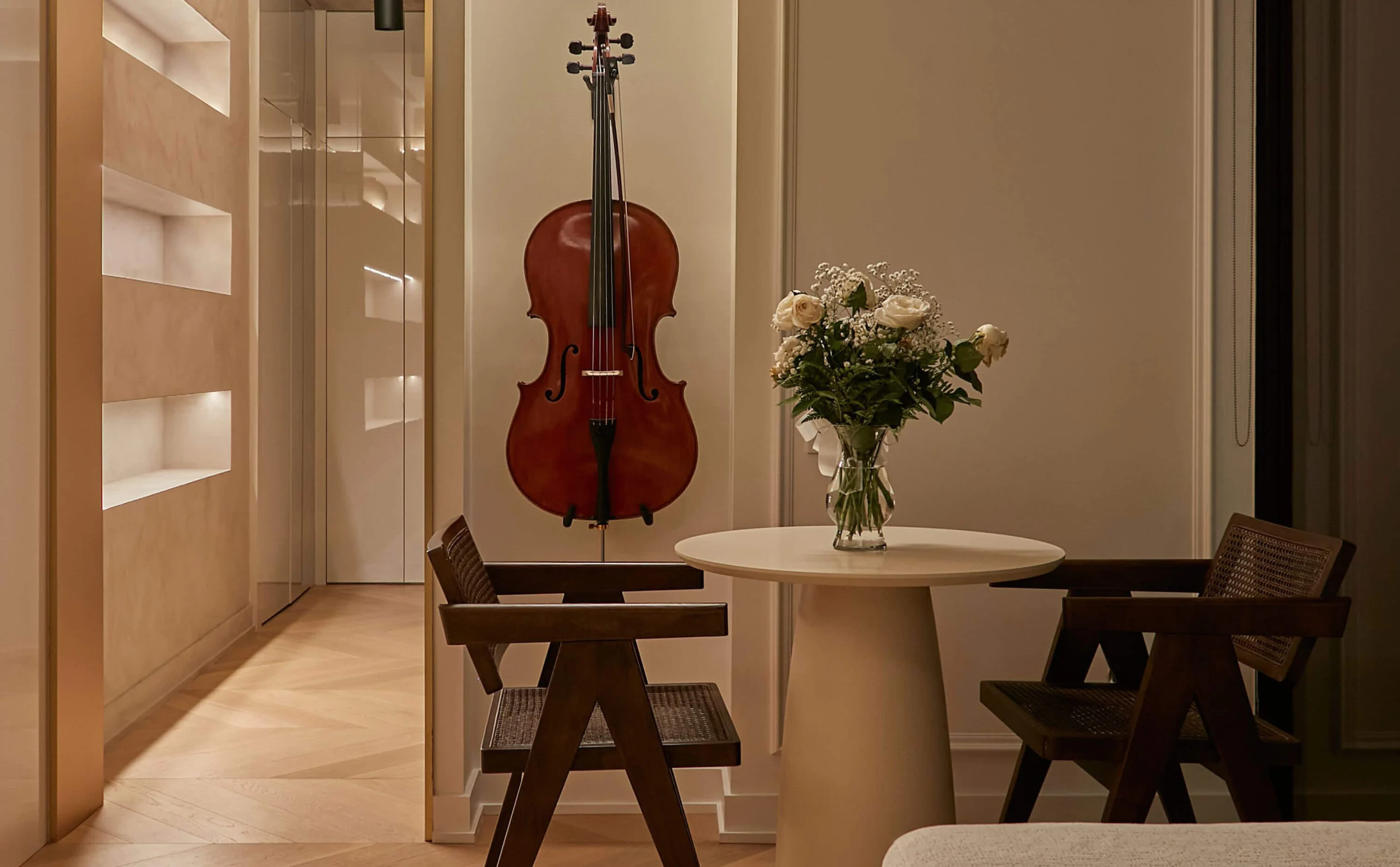 Dining table with sculptural chairs, art and decorative objects