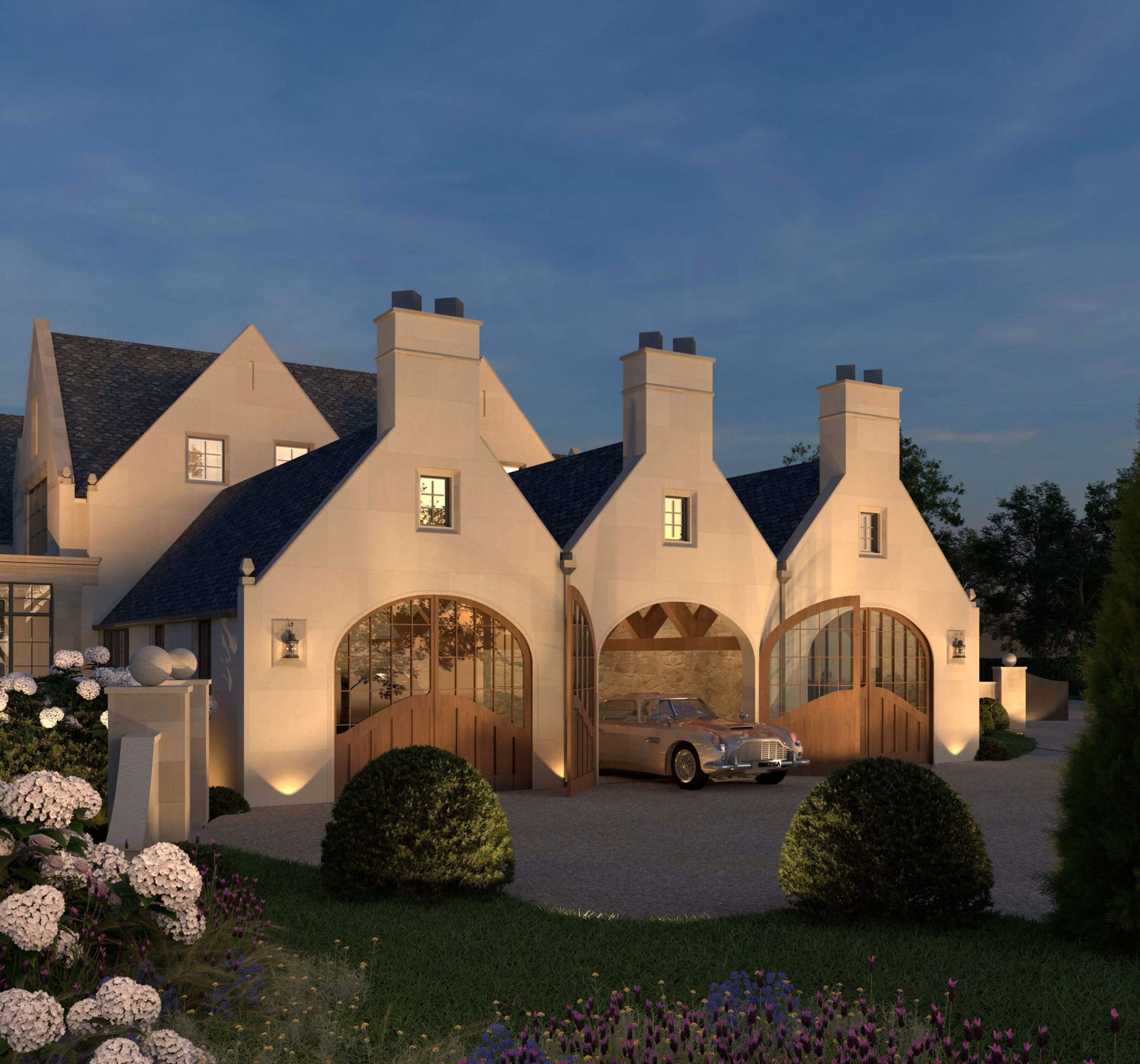 Stable-style garages opening onto the entrance court