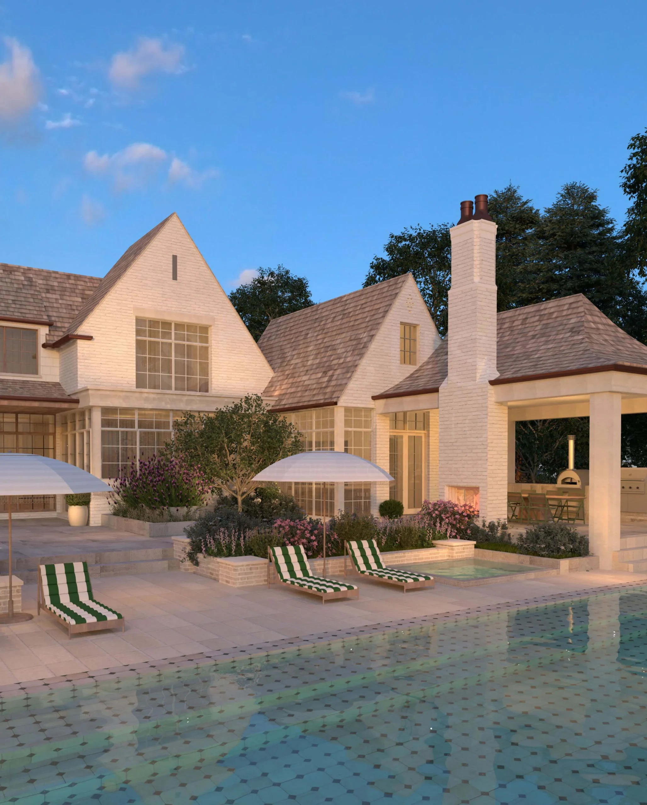 French Country Home pool and gardens illuminated at night