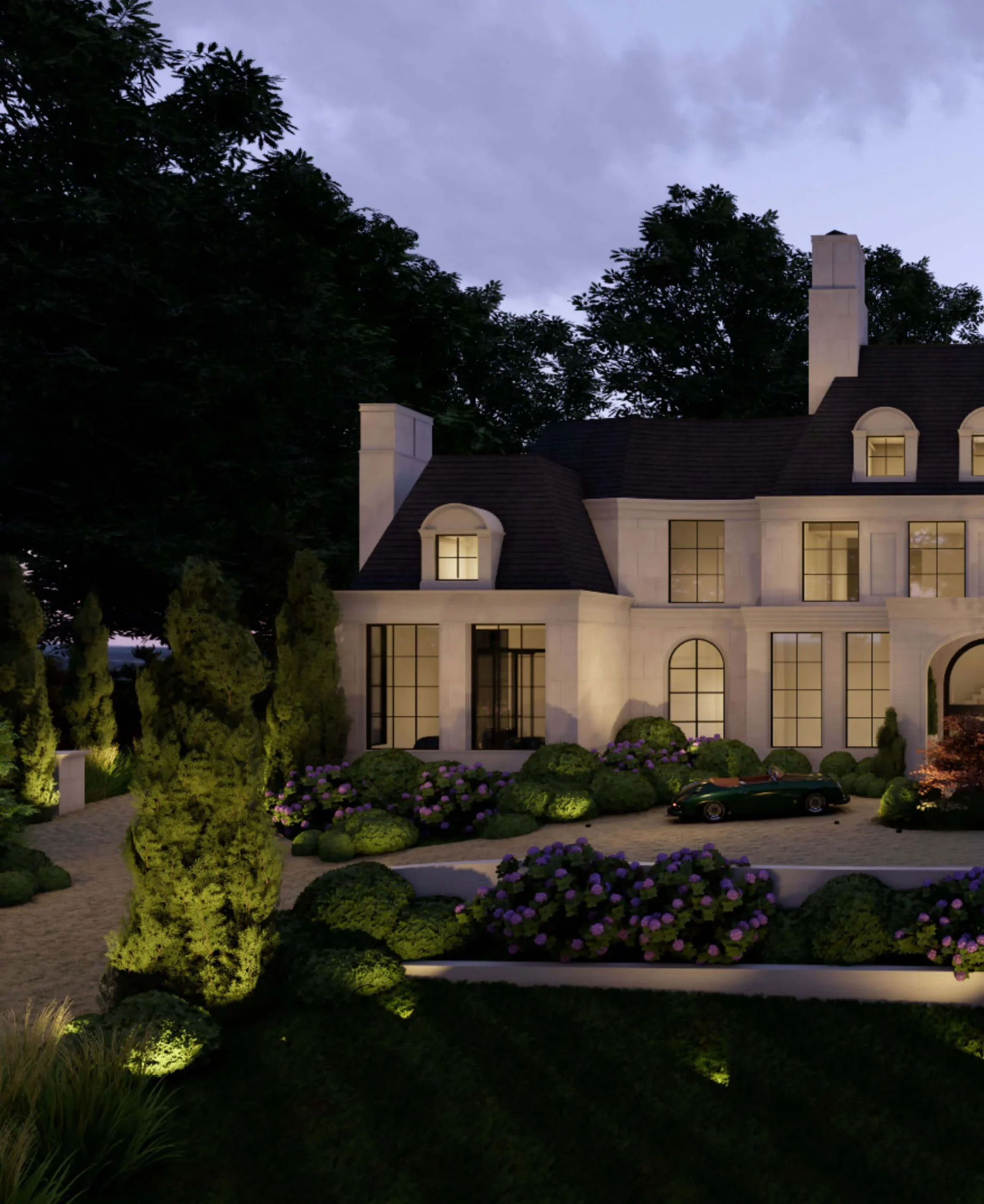 Illuminated house framed by trees