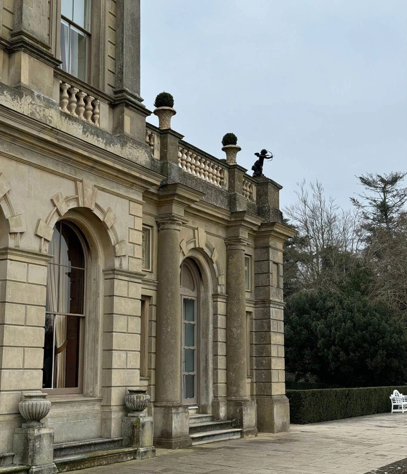 Arched stone windows and balustrade on the manor facade