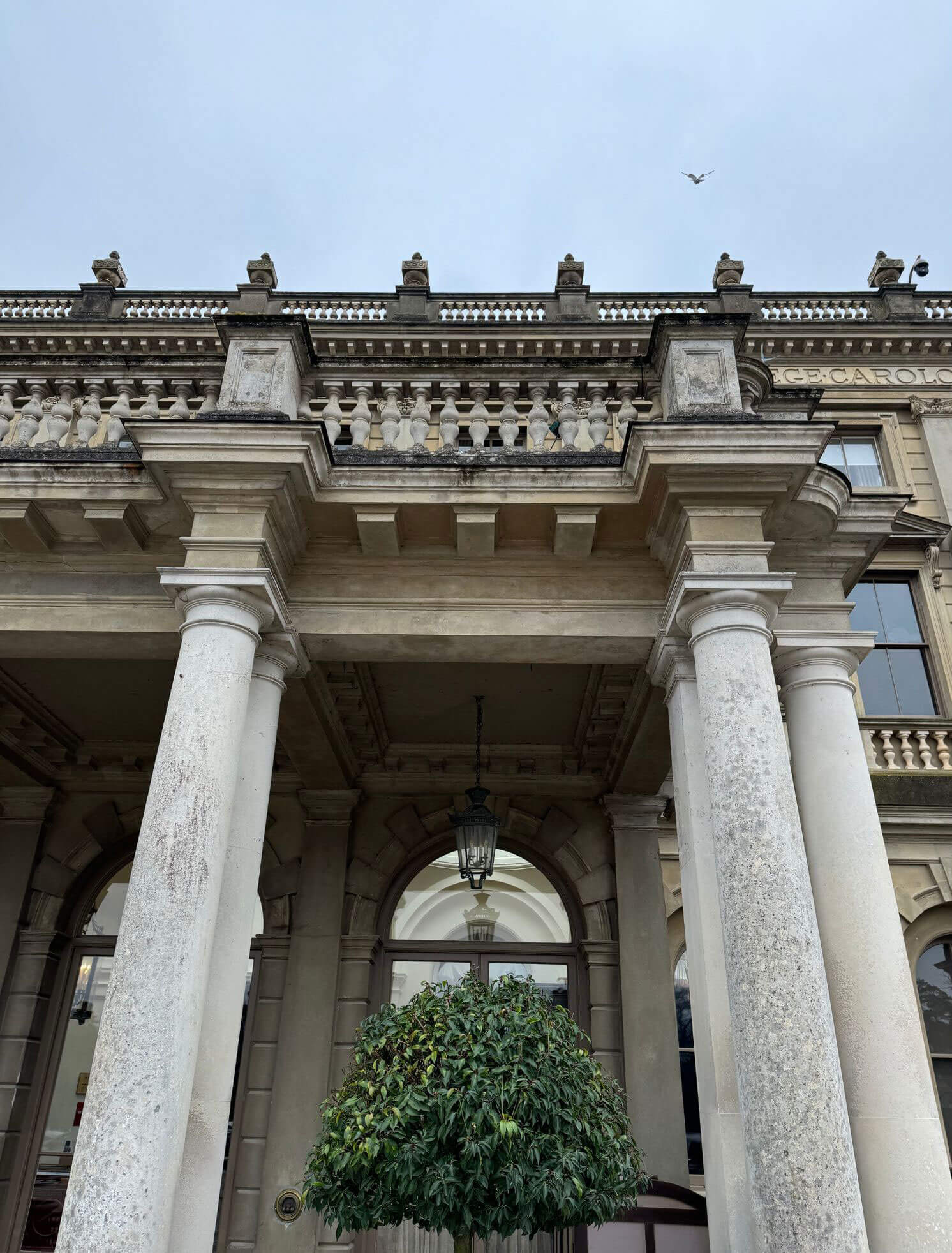 Tall classical columns framing the manor entrance