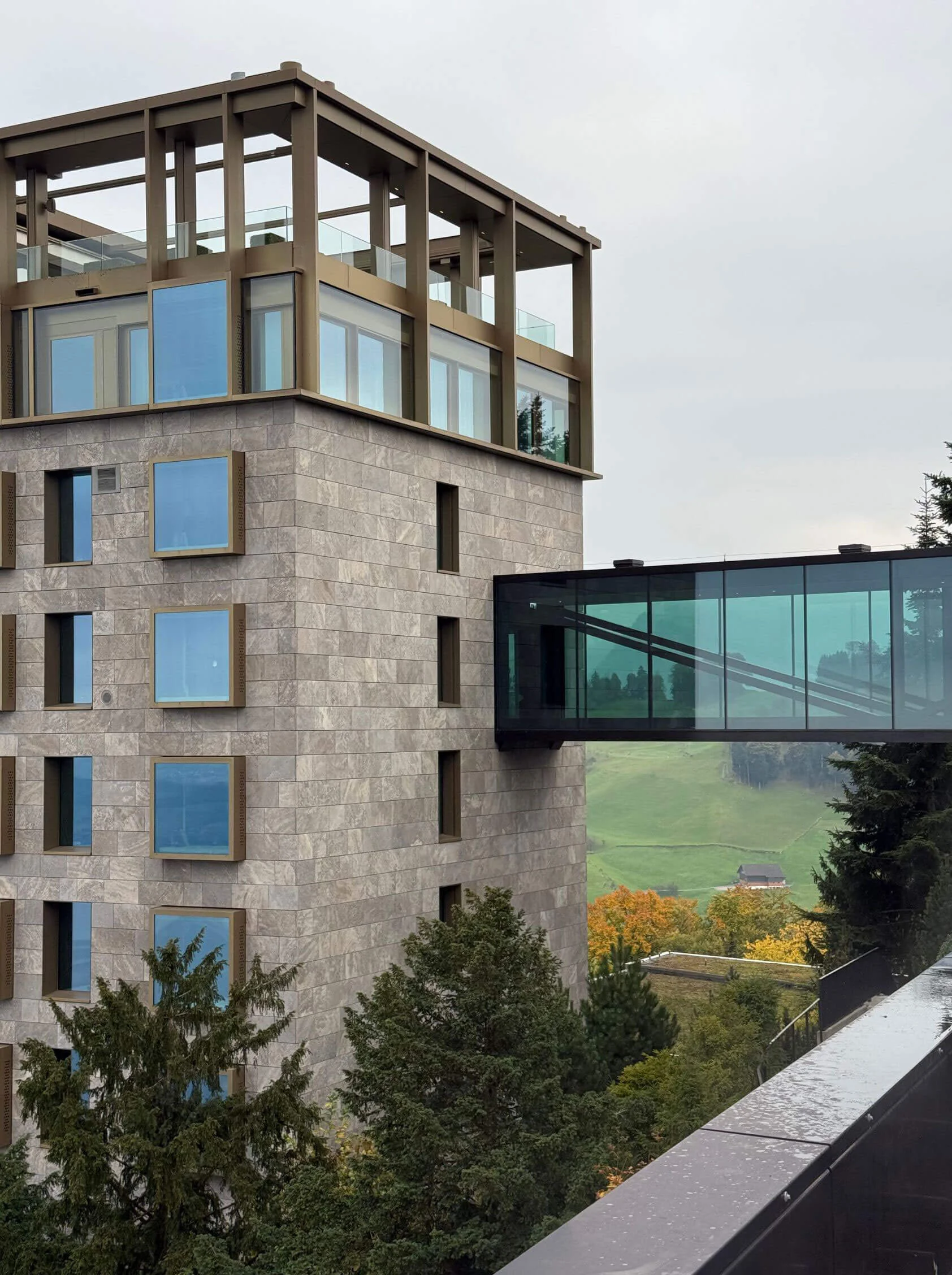 Limestone tower connected by a glazed bridge