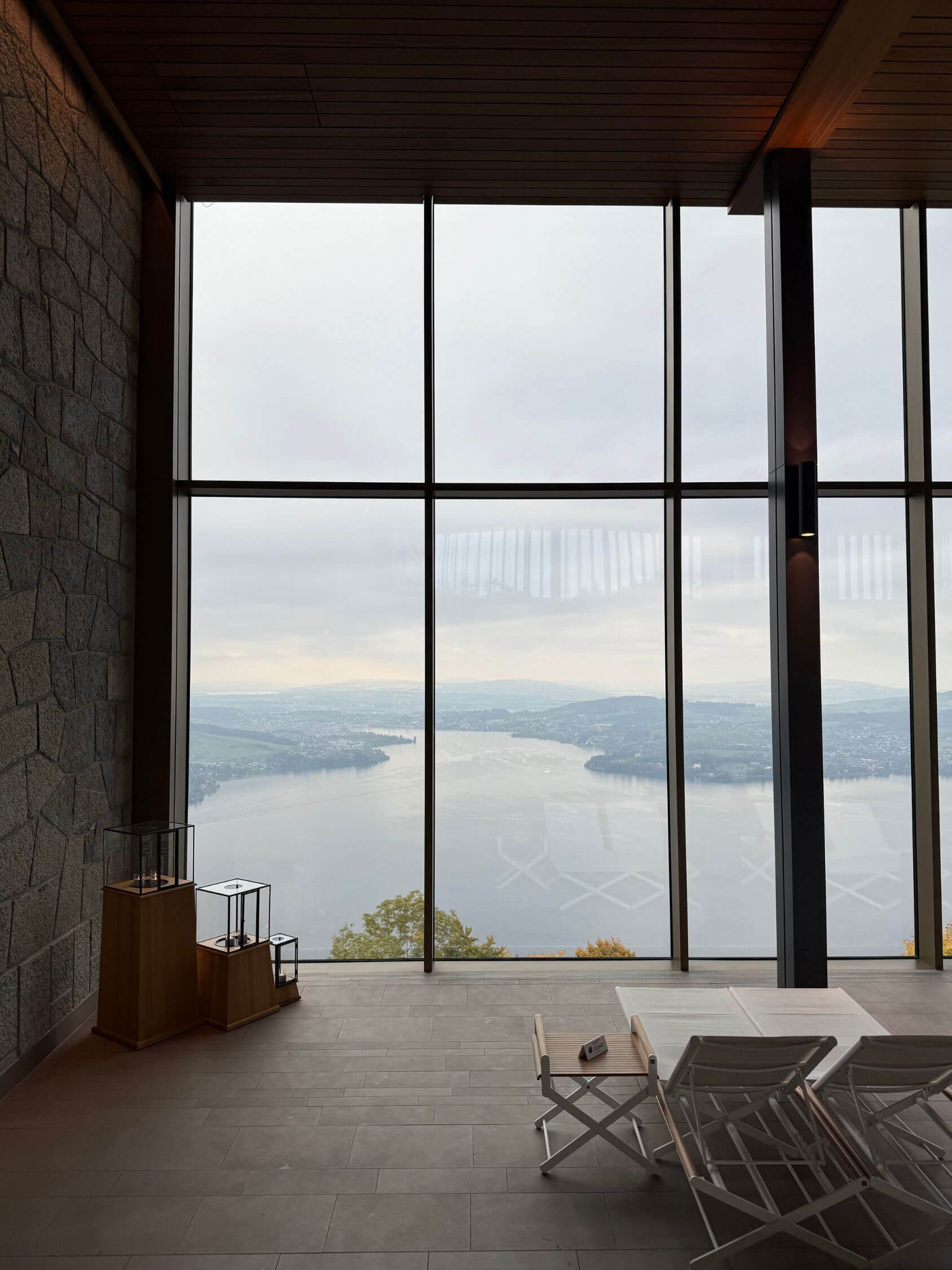 Tall window framing distant lake and mountain views