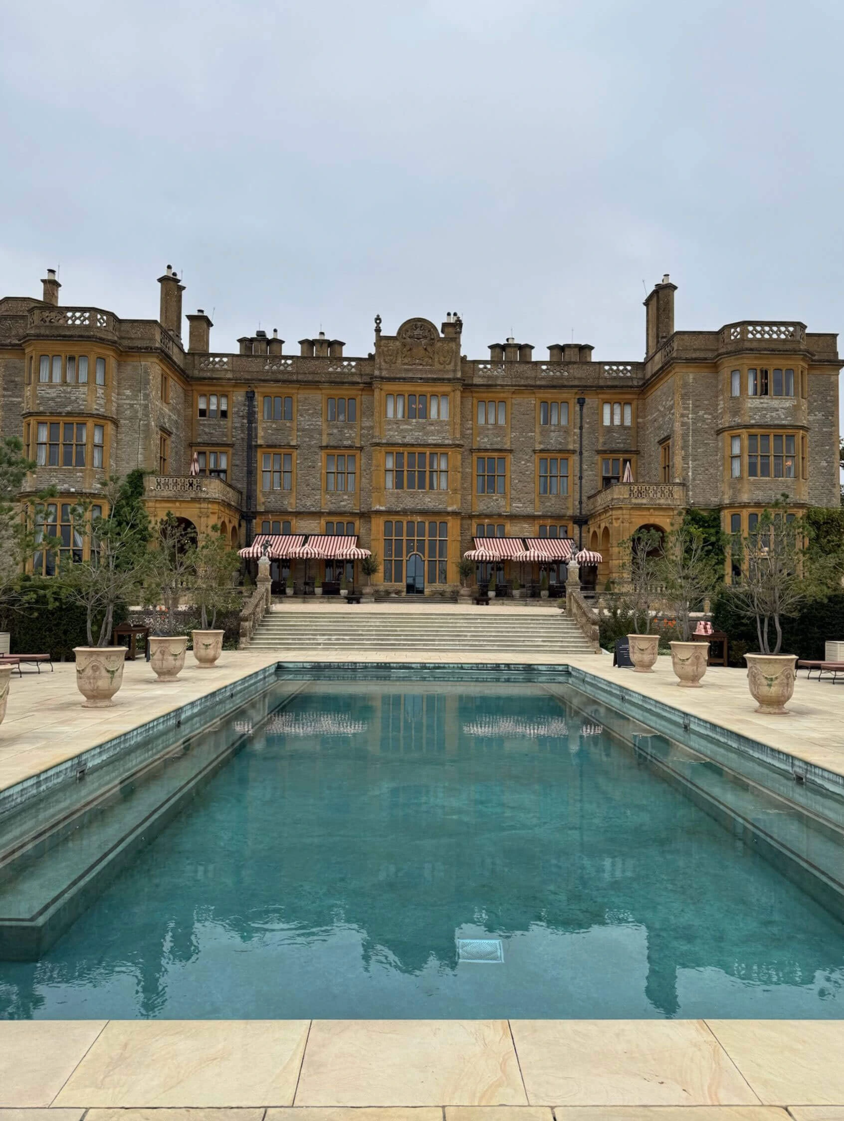Estelle Manor facade beyond a formal outdoor pool