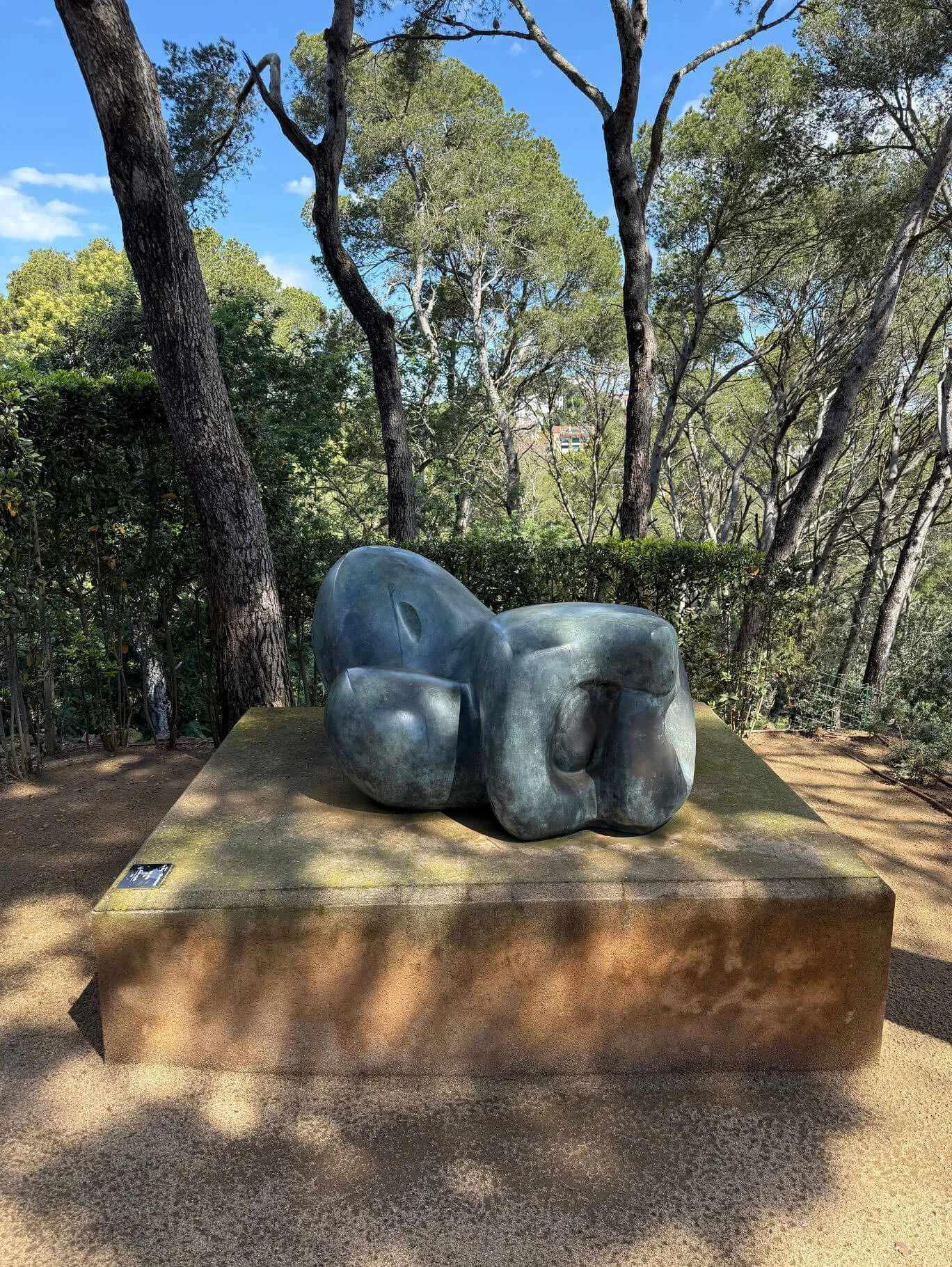 Rounded abstract sculpture on a broad low plinth